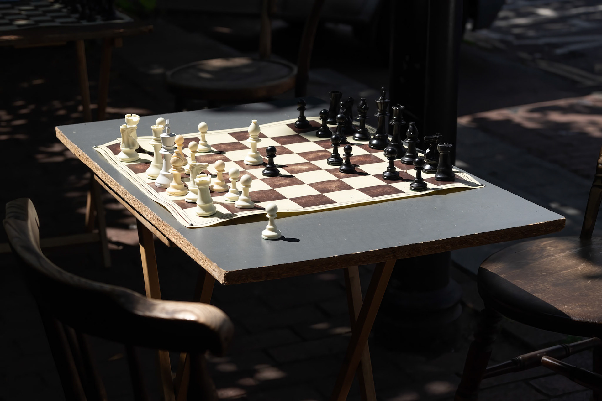 EAST GRINSTEAD, WEST SUSSEX, UK - JULY 1 : Chess Boards in the street ready for a game in East Grinstead on July 1, 2022