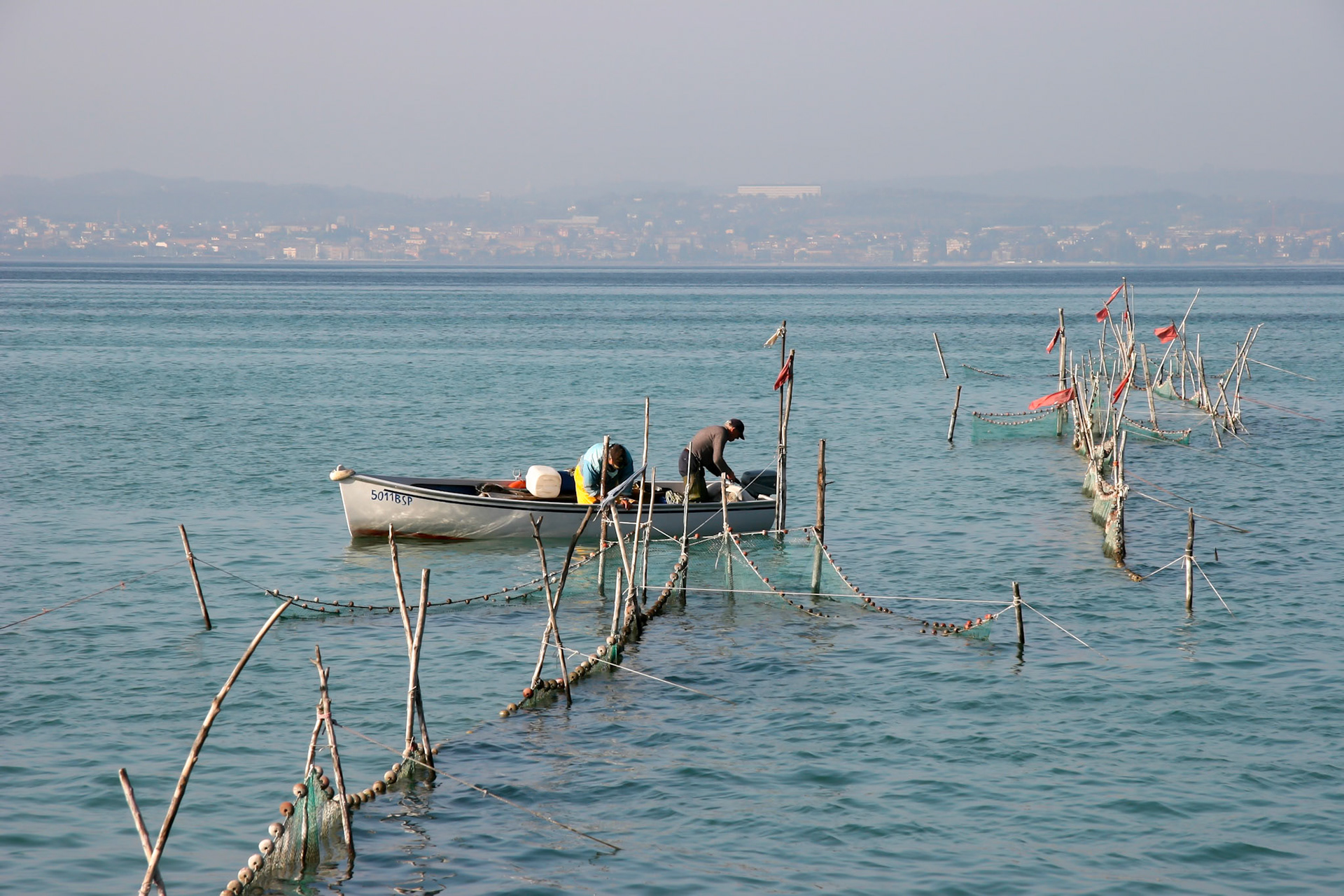 Fishermen Checking Their Nets at Lake Garda