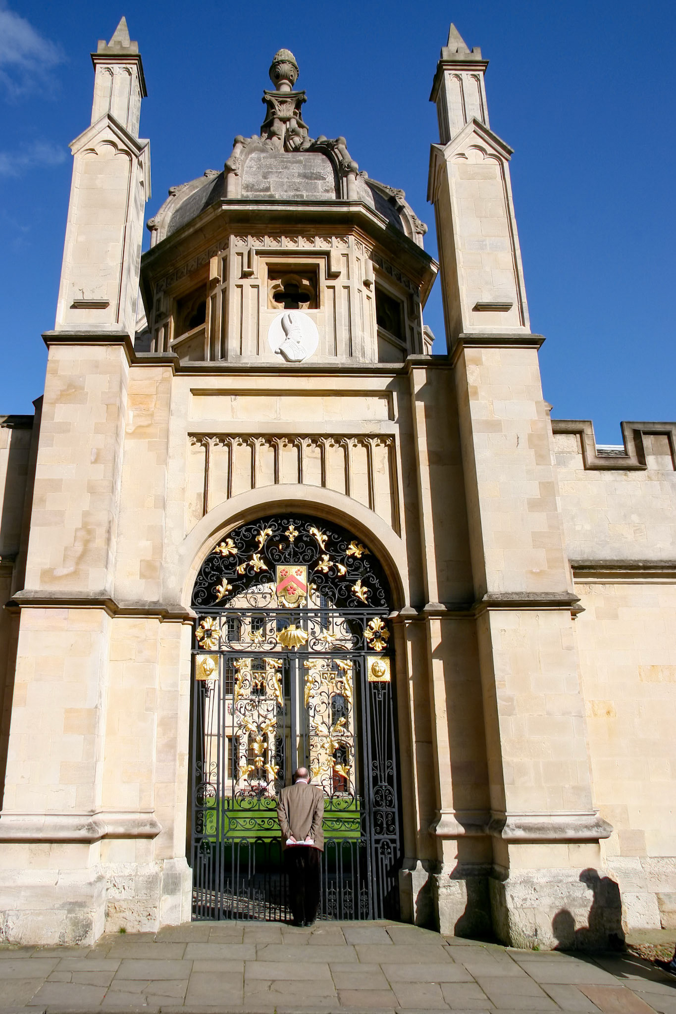 OXFORD, OXFORDSHIRE/UK - MARCH 25 : Decorated ironwork entrance gate for All Souls College in Oxford on March 25, 2005. Unidentified man