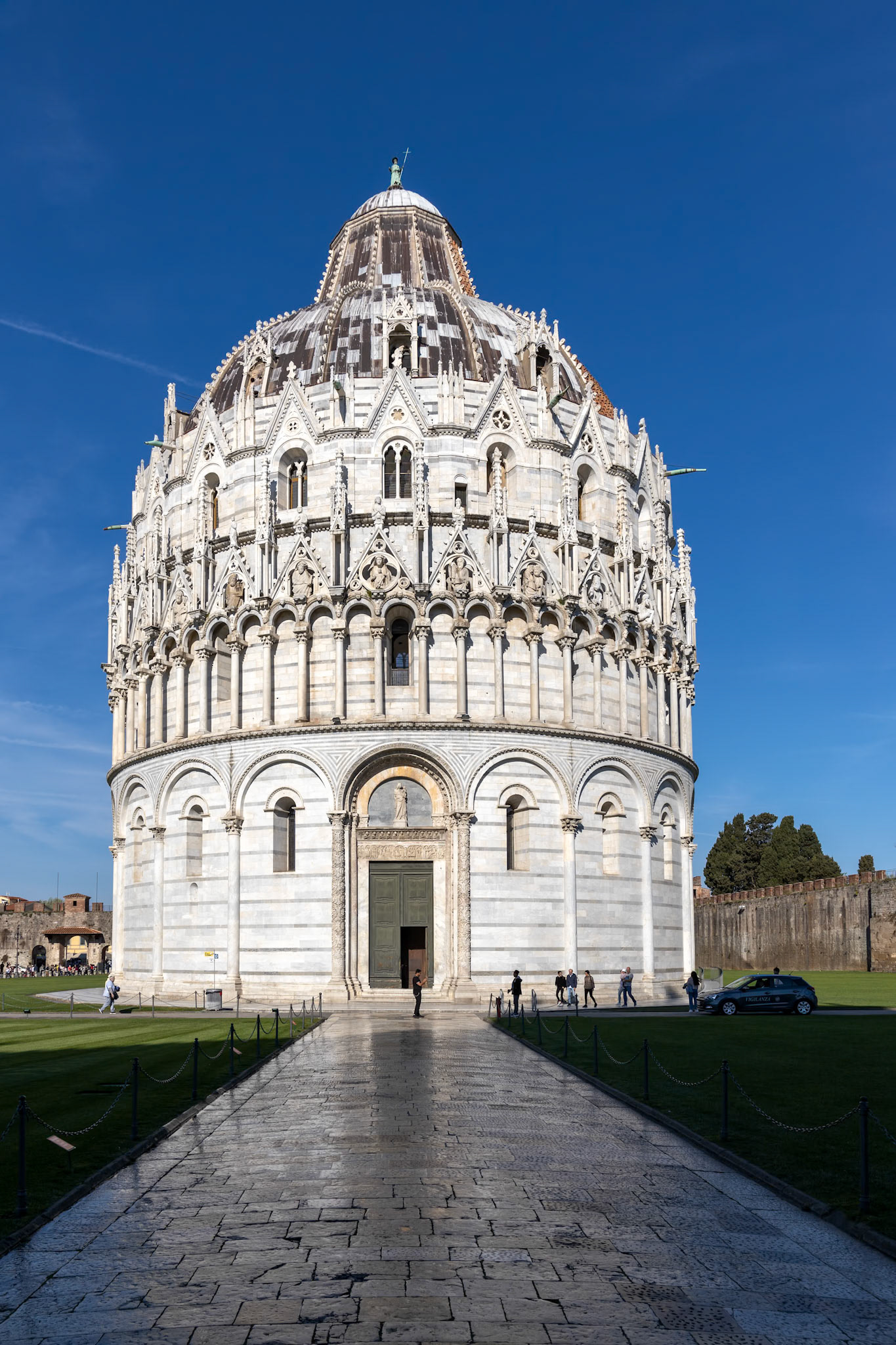 PISA, TUSCANY/ITALY  - APRIL 18 : Exterior view of the Baptistery in Pisa Tuscany Italy on April 18, 2019. Unidentified people