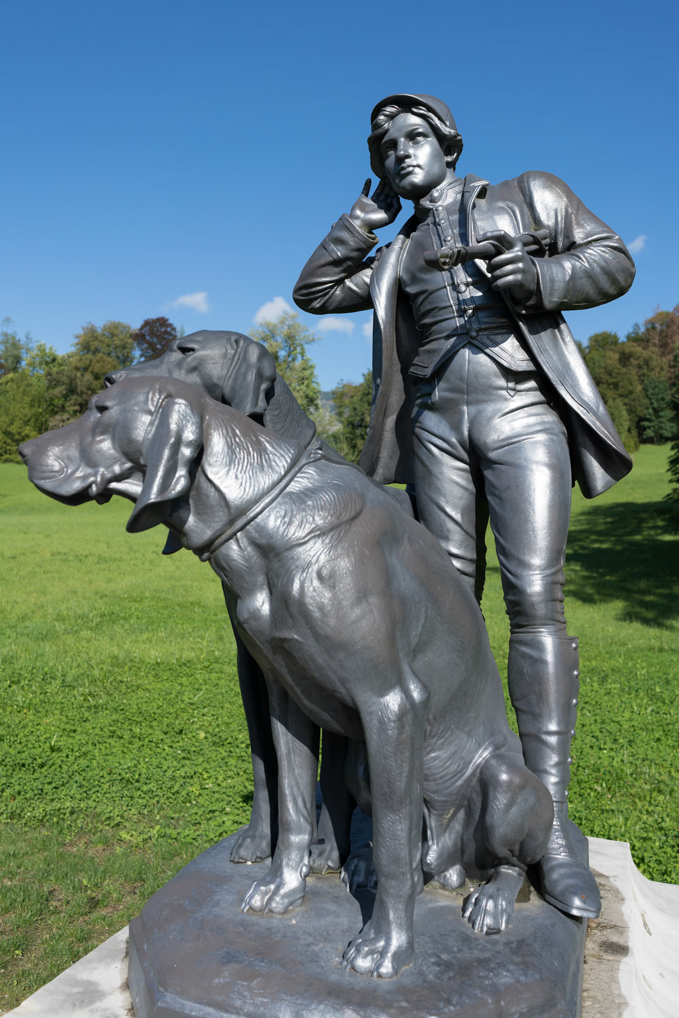 Statue of a Man and Two Dogs at the Imperial Kaiservilla in Bad Ischl