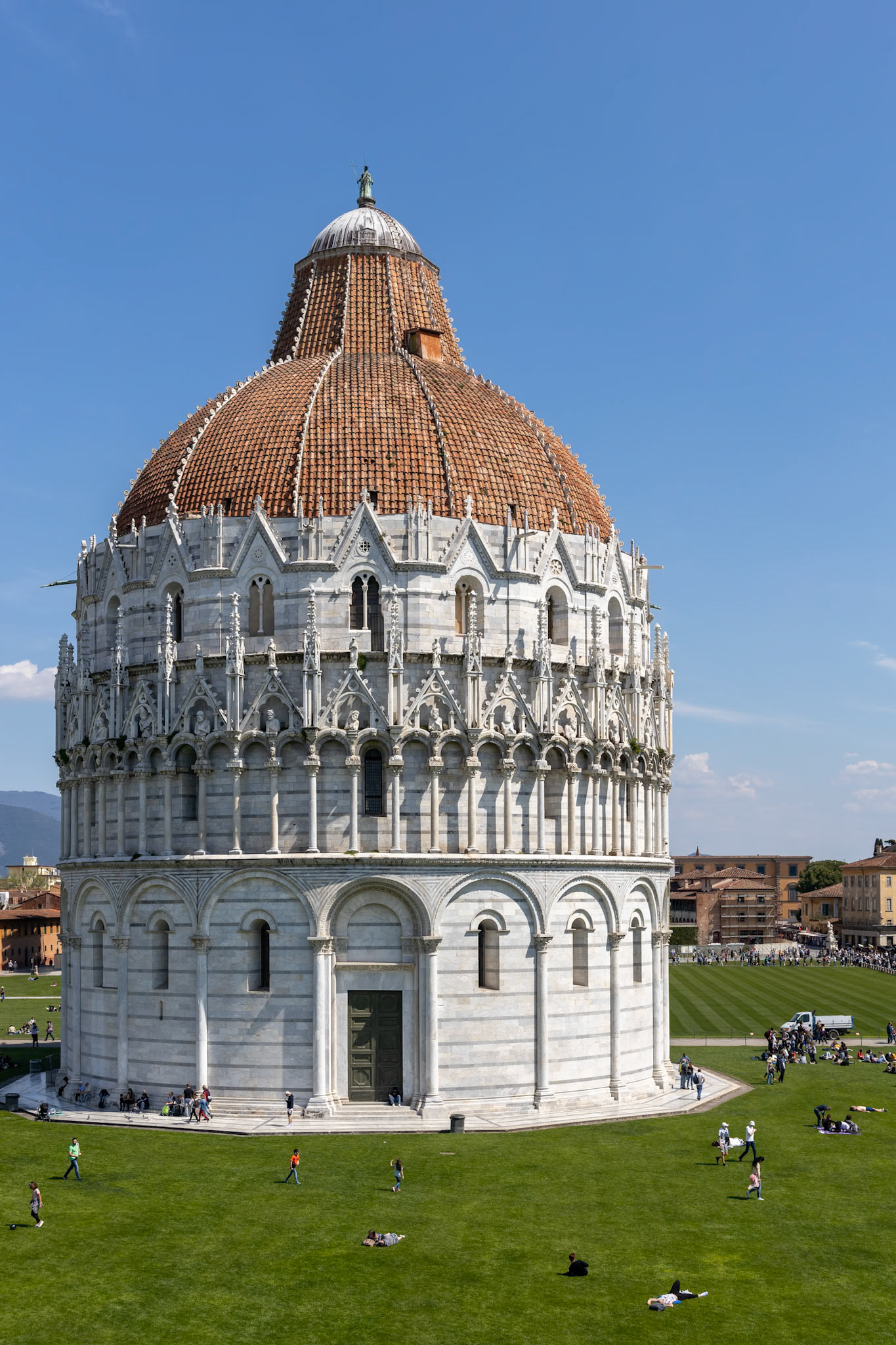 PISA, TUSCANY/ITALY  - APRIL 18 : Exterior view of the Baptistery in Pisa Tuscany Italy on April 18, 2019. Unidentified people