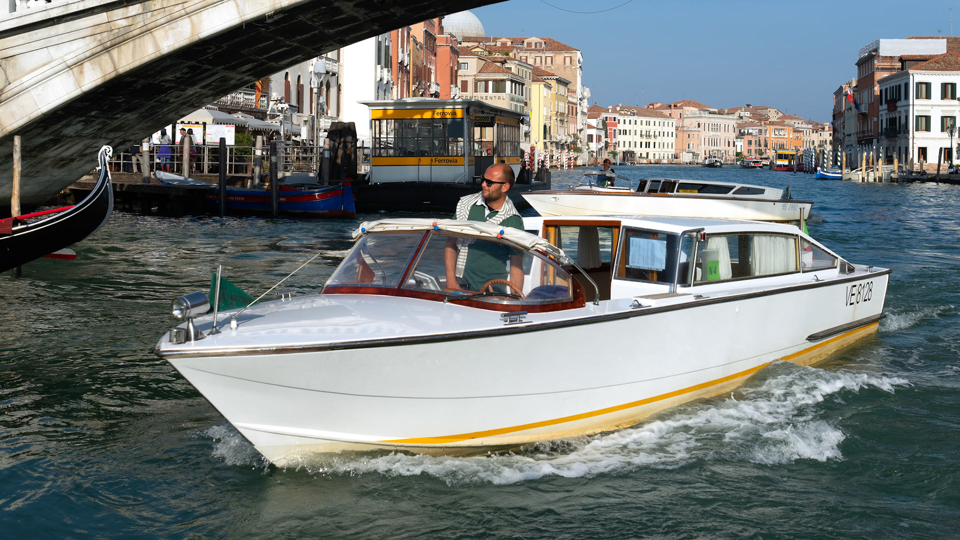 VENICE, ITALY - OCTOBER 12 : Motorboat Cruising down the Grand Canal in Venice on October 12, 2014. Unidentified people.