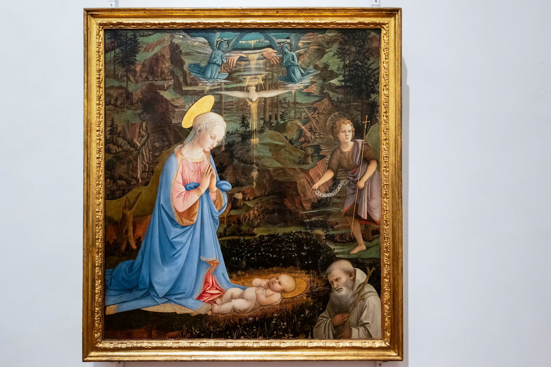 FLORENCE, TUSCANY/ITALY - OCTOBER 19 : Adoration of the Christ child with the young St John the Baptist painting in the Uffizi gallery in Florence on October 19, 2019