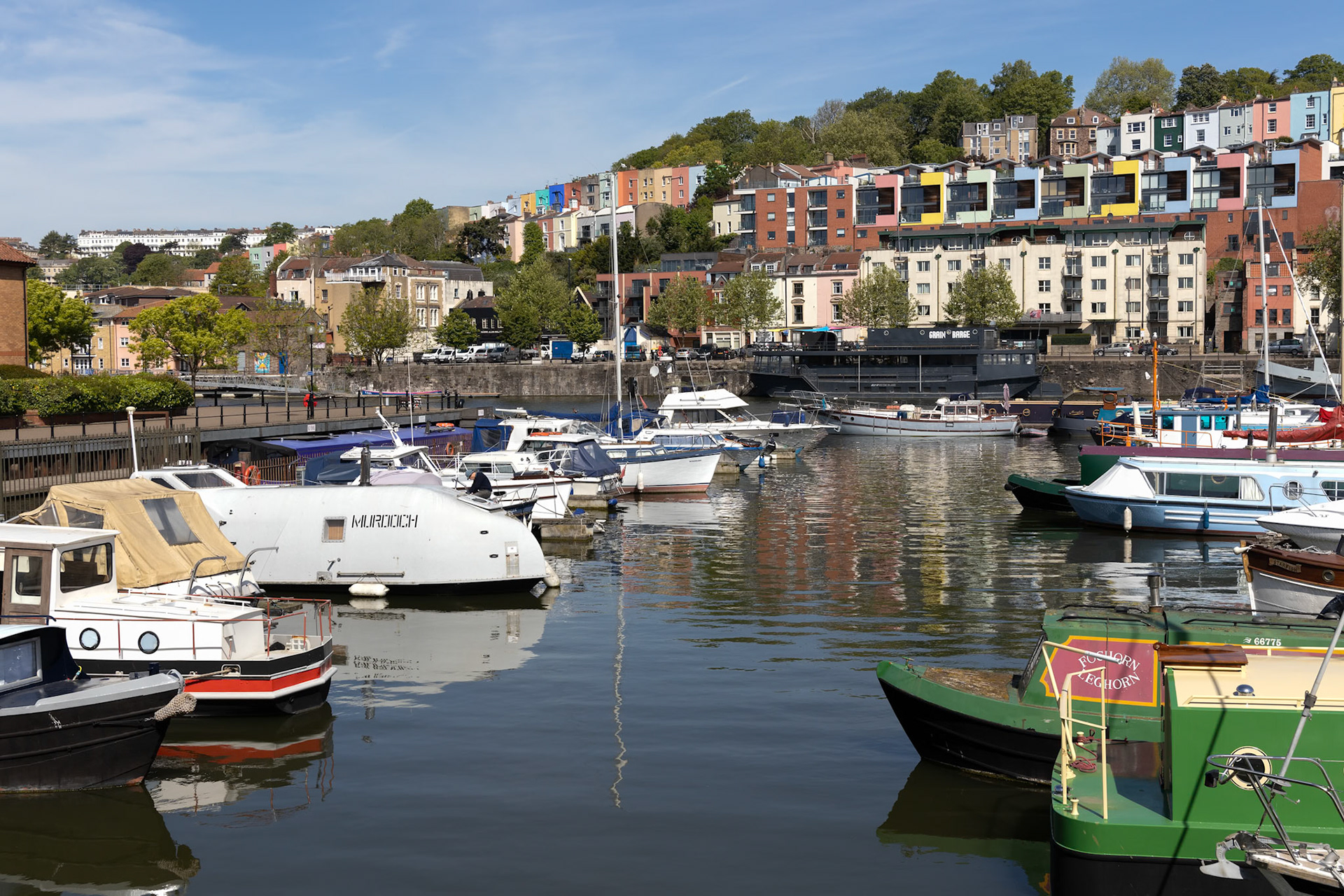 BRISTOL, UK - MAY 14 : View of boats and colourful apartments along the River Avon in Bristol on May 14, 2019. One unidentified person