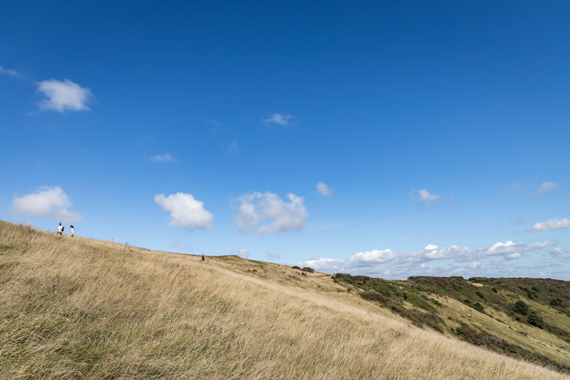 ALFRISTON, EAST SUSSEX/UK - SEPTEMBER 6 : People walking over the South Downs on a summers day near Alfriston in East Sussex on September 6, 2020. Unidentified people