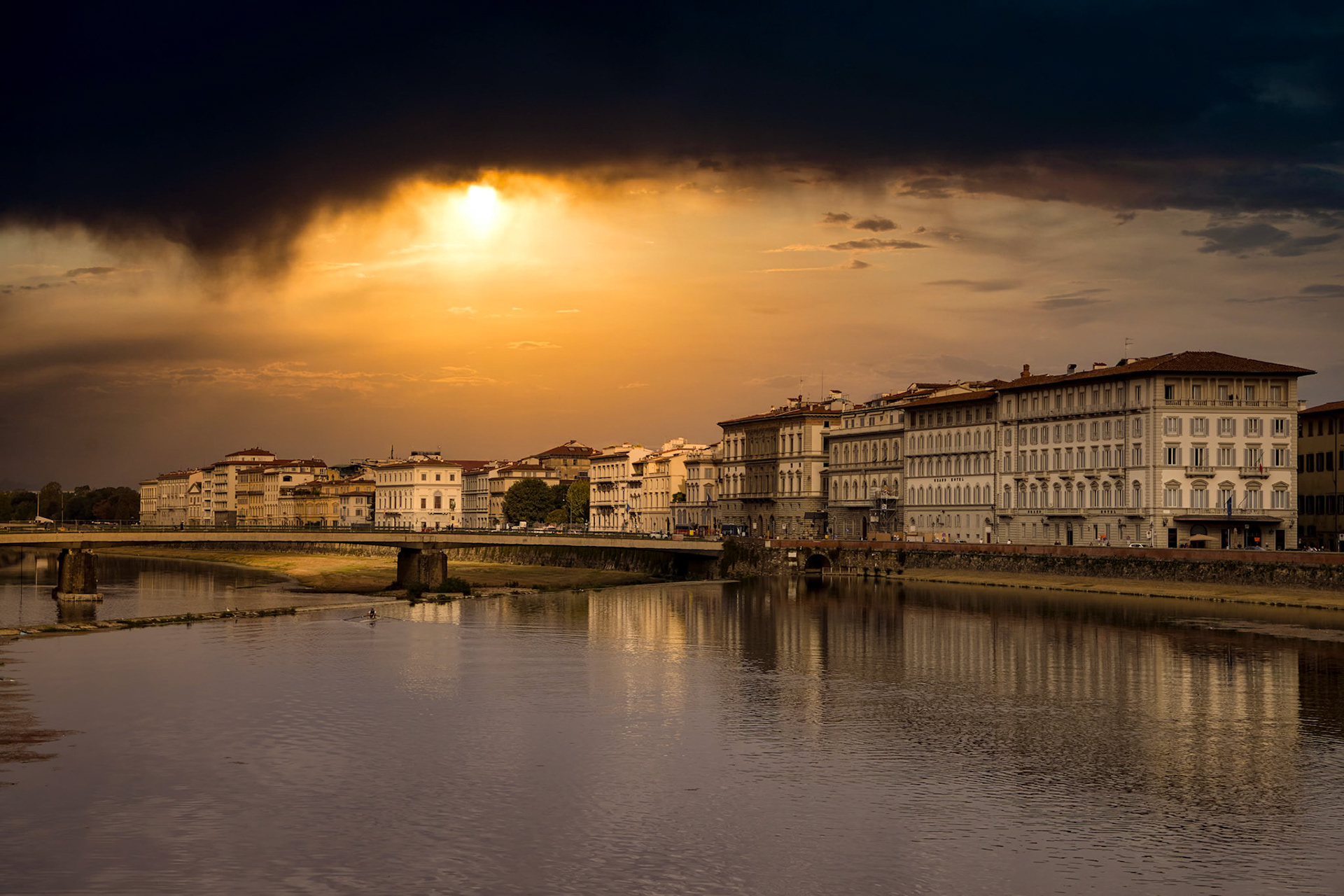 FLORENCE, TUSCANY/ITALY - OCTOBER 20 : View of buildings along and across the River Arno in Florence  on October 20, 2019. Unidentified people.