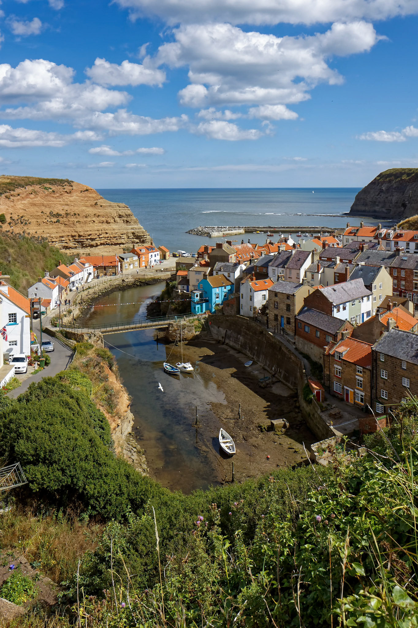 STAITHES, NORTH YORKSHIRE/UK - AUGUST 21 : View of Staithes Harbour North Yorkshire on August 21, 2010. Unidentified people