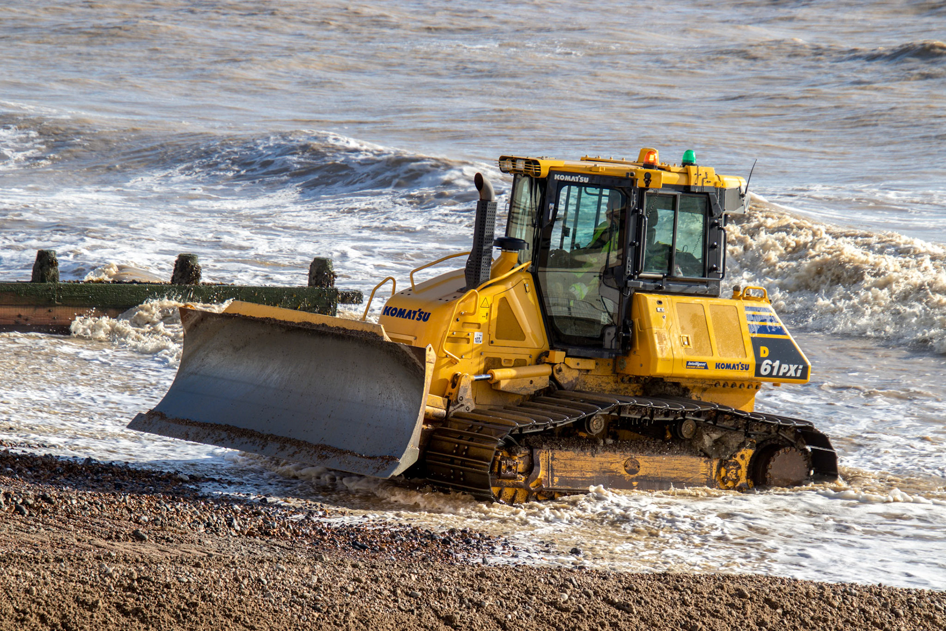 WORTHING, WEST SUSSEX/UK - NOVEMBER 13 : Bulldozer repairing sea defences in Worthing West Sussex on November 13, 2018. Unidentified people.