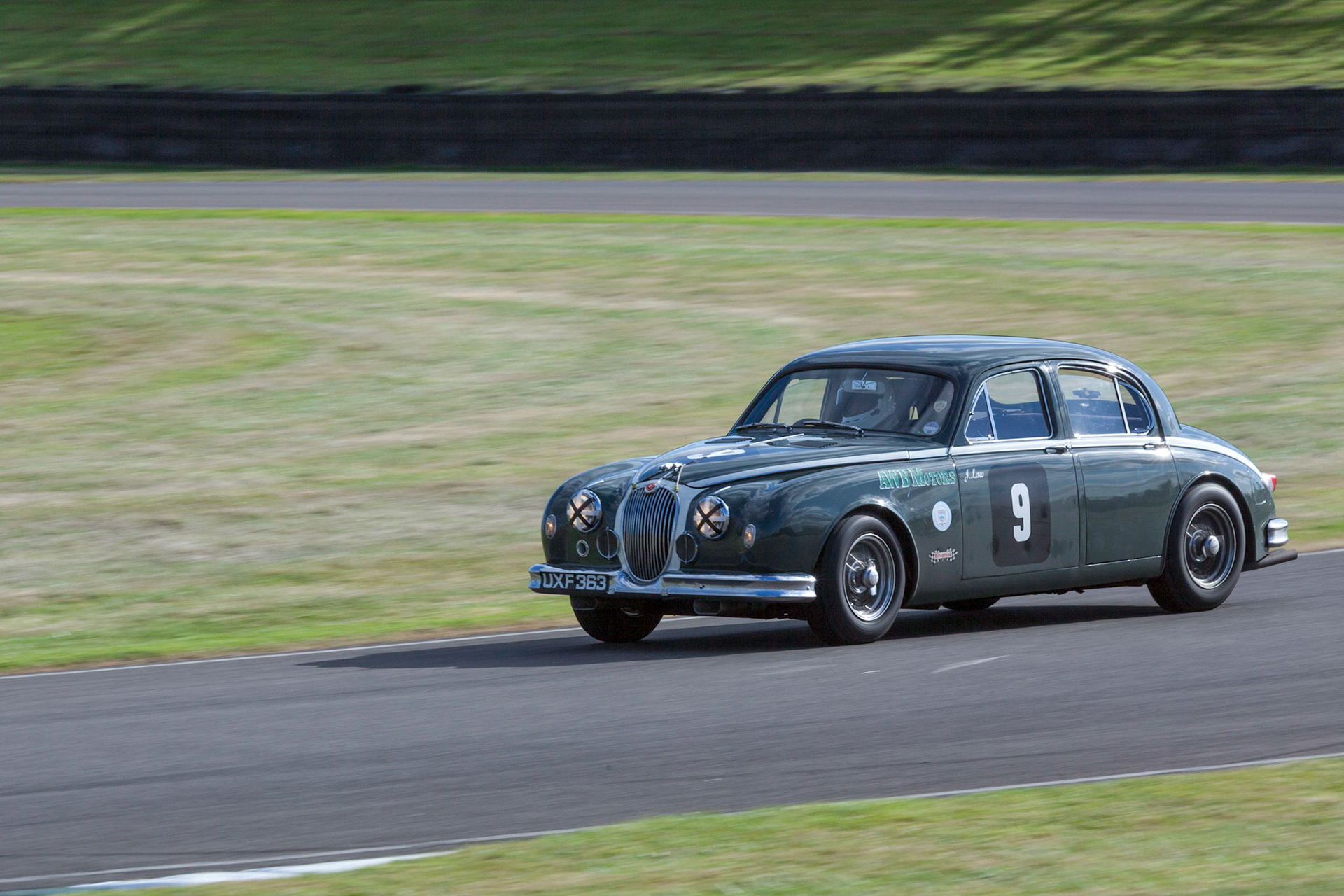 GOODWOOD, WEST SUSSEX/UK - SEPTEMBER 14 : Vintage Racing at Goodwood on September 14, 2012. One unidentified person