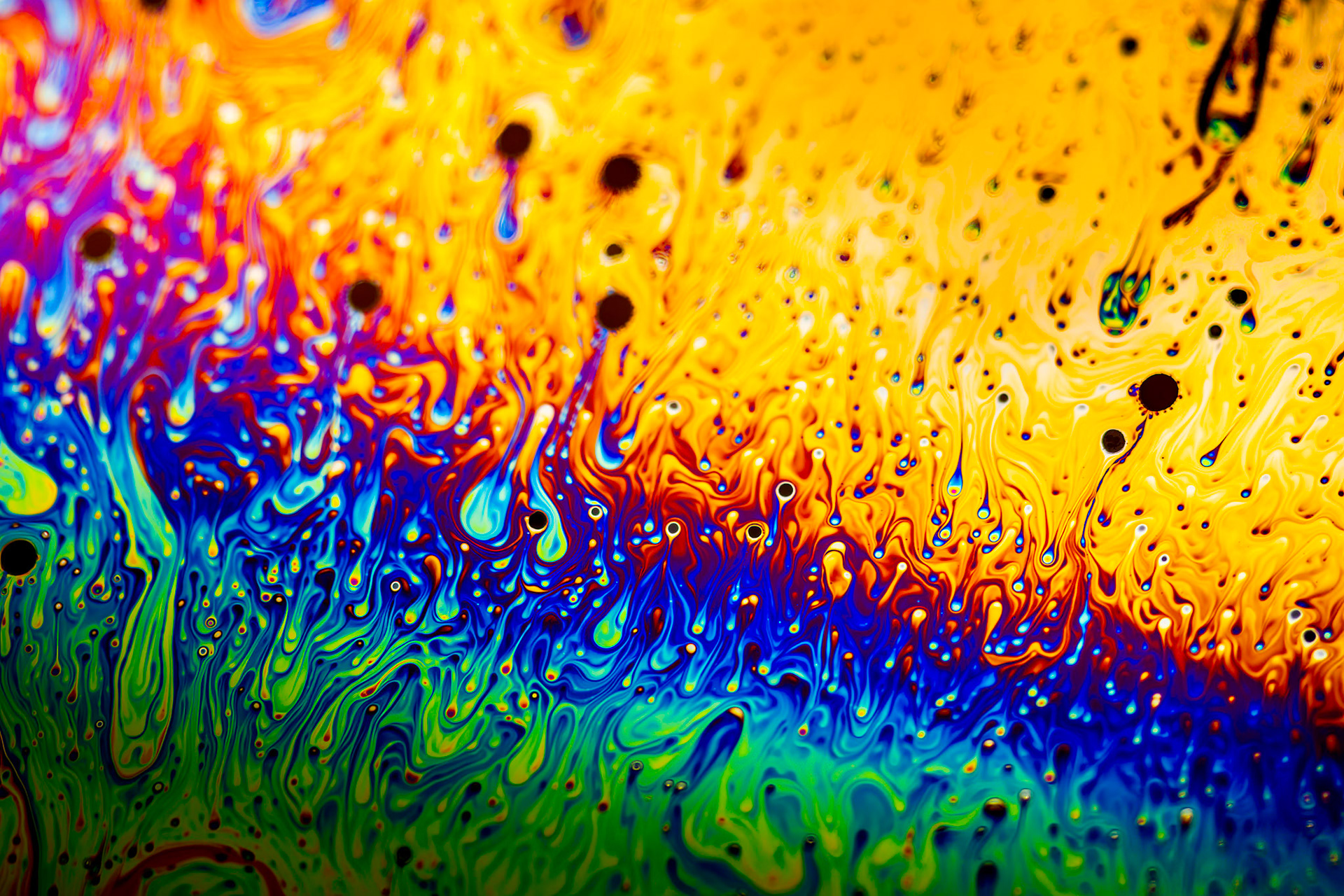 Extreme close-up of the colourful surface of a bubble