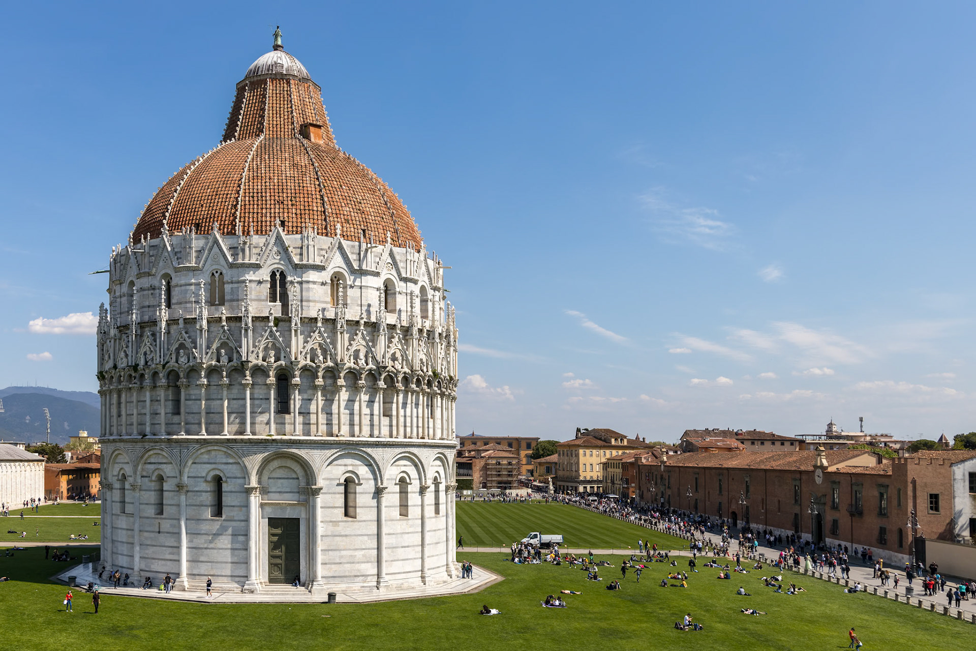 PISA, TUSCANY/ITALY  - APRIL 18 : Exterior view of the Baptistery in Pisa Tuscany Italy on April 18, 2019. Unidentified people