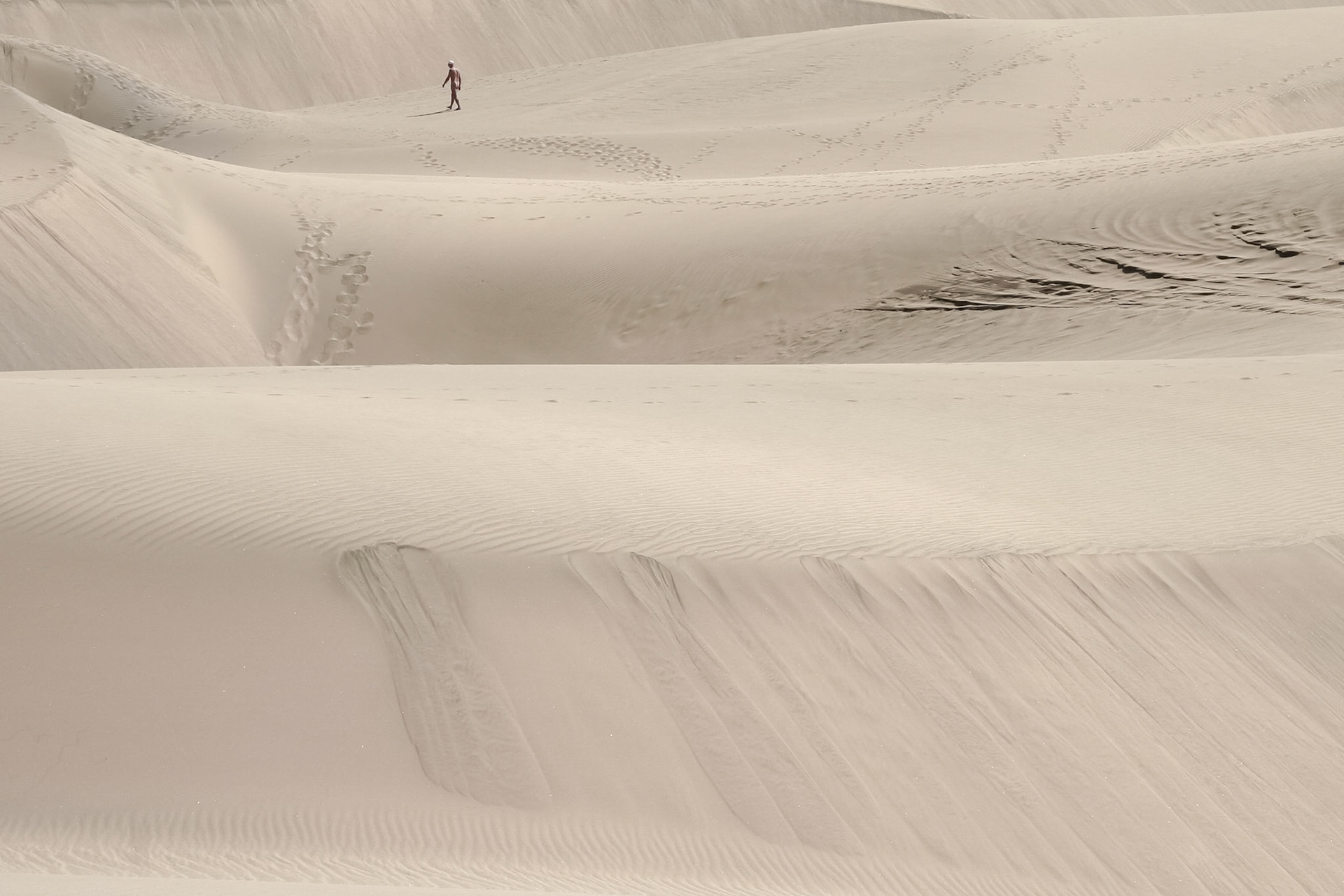 Nudist Walking on the Sand Dunes near Mas Palomas Gran Canaria