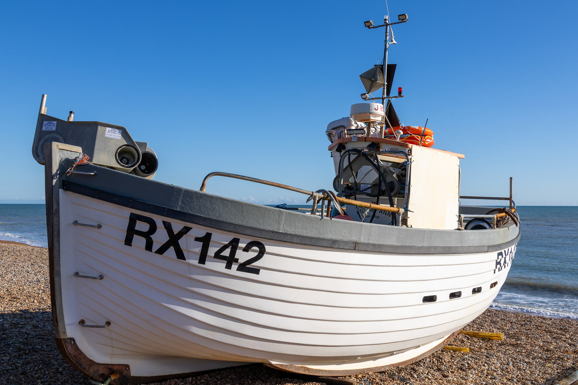 Hastings, East Sussex, UK - February 12. View of a fishing boat on the beach at Hastings, East Sussex on February 12, 2024