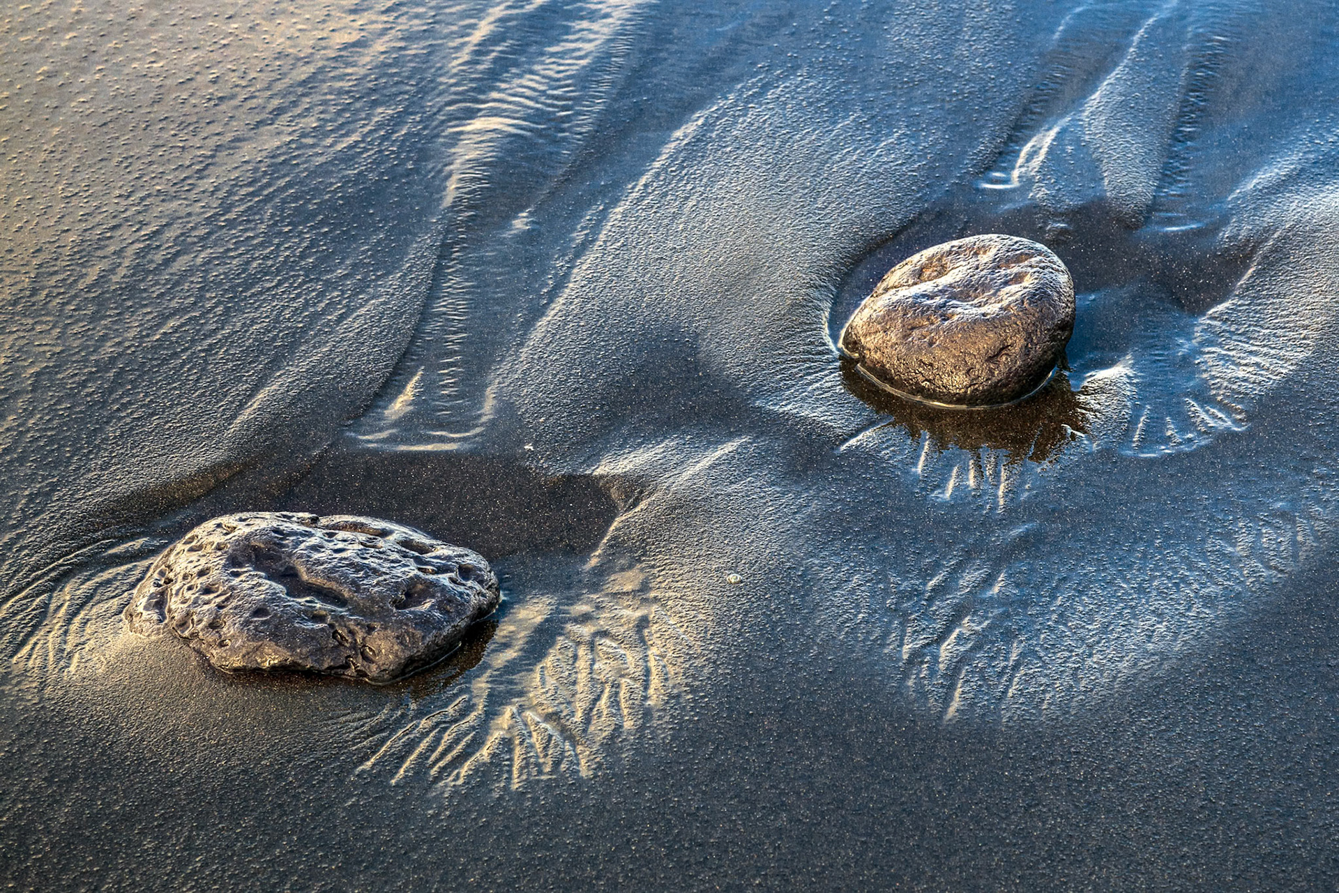 Two Rocks in Volcanic Sand