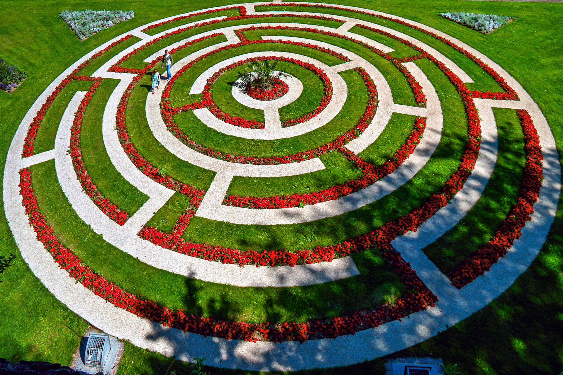 Two Young Girls Exploring a Maze in Boulogne