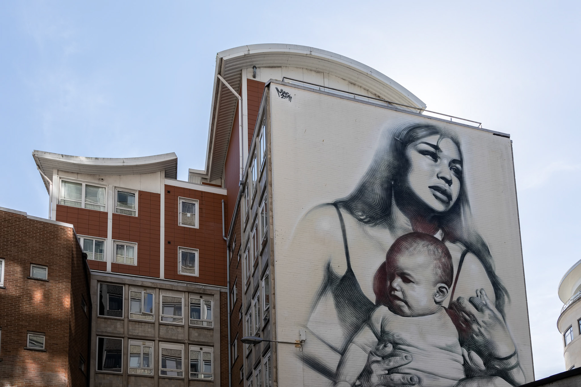BRISTOL, UK - MAY 14 : Woman and baby portrait Graffiti on a wall  in Bristol on May 14, 2019