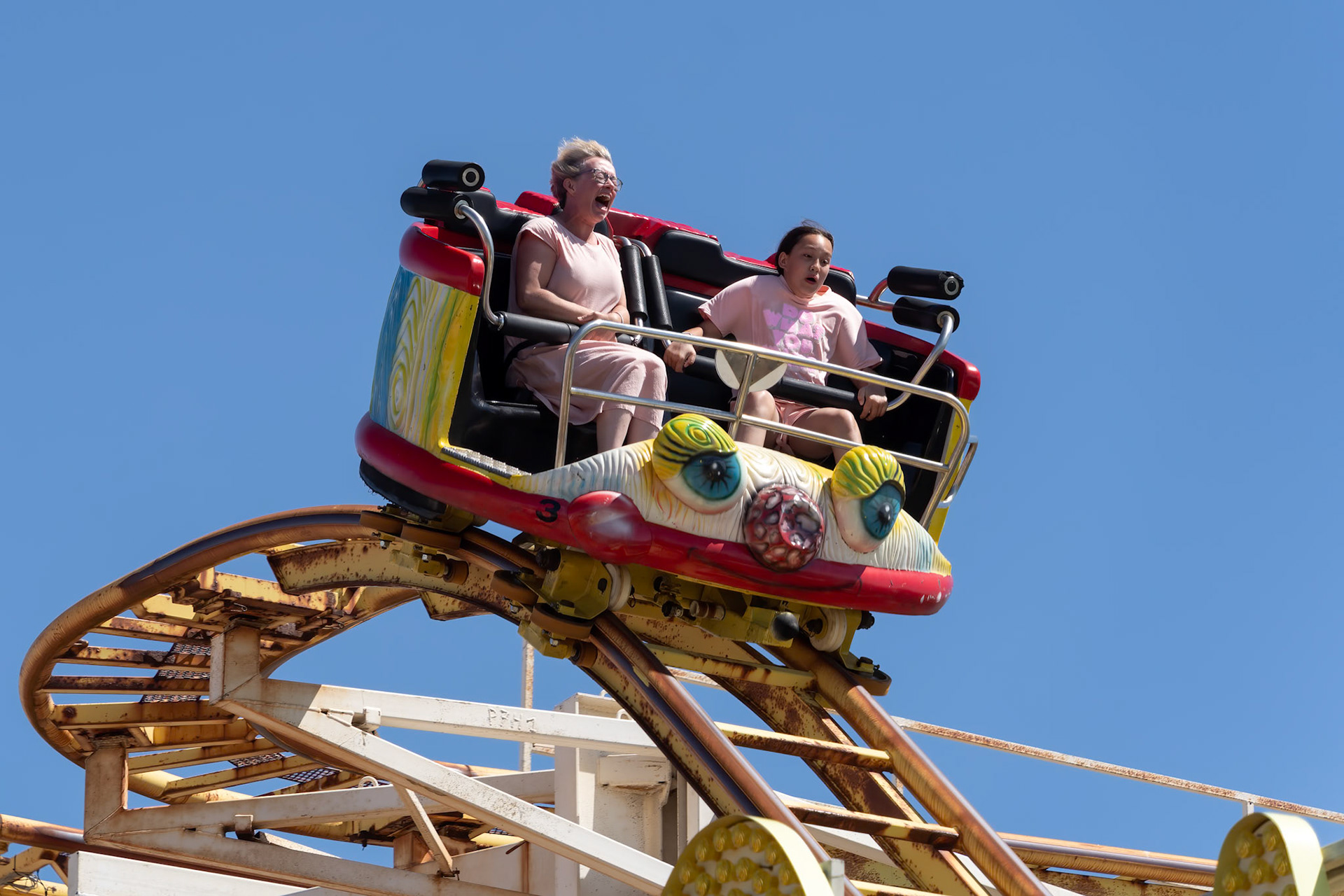 Brighton, East Sussex, UK - July 15, 2022 : View of the scenic railway ride on the pier  in Brighton on July 15, 2022. Two unidentified people