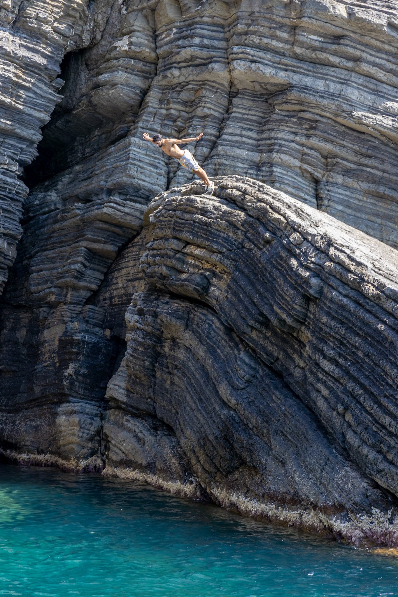 VERNAZZA LIGURIA/ITALY  - APRIL 20 : Man diving into the sea at Vernazza Liguria Italy on April 20, 2019. Unidentified man
