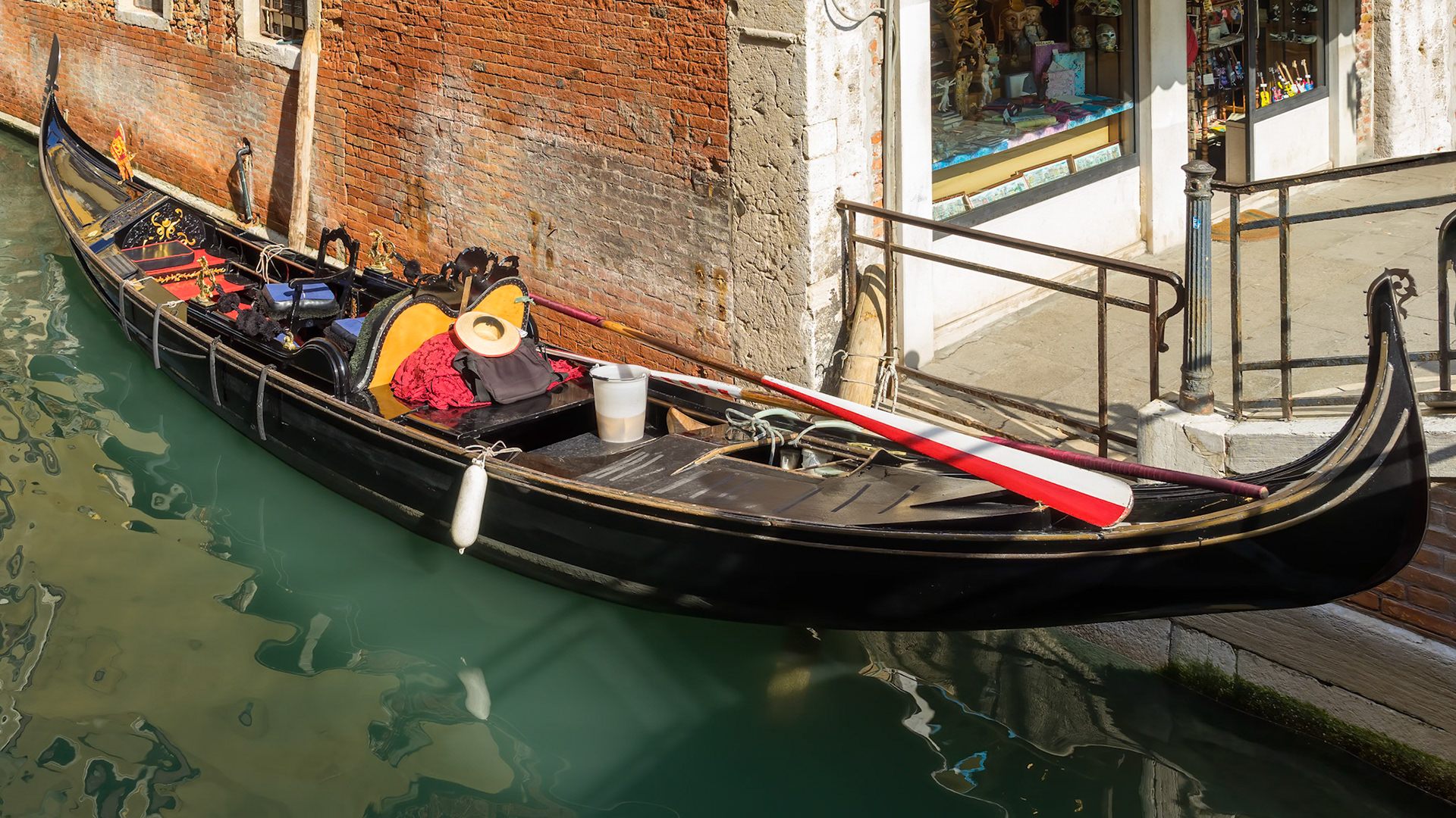 VENICE, ITALY - OCTOBER 12 : Gondola moored in a canal in Venice on October 12, 2014