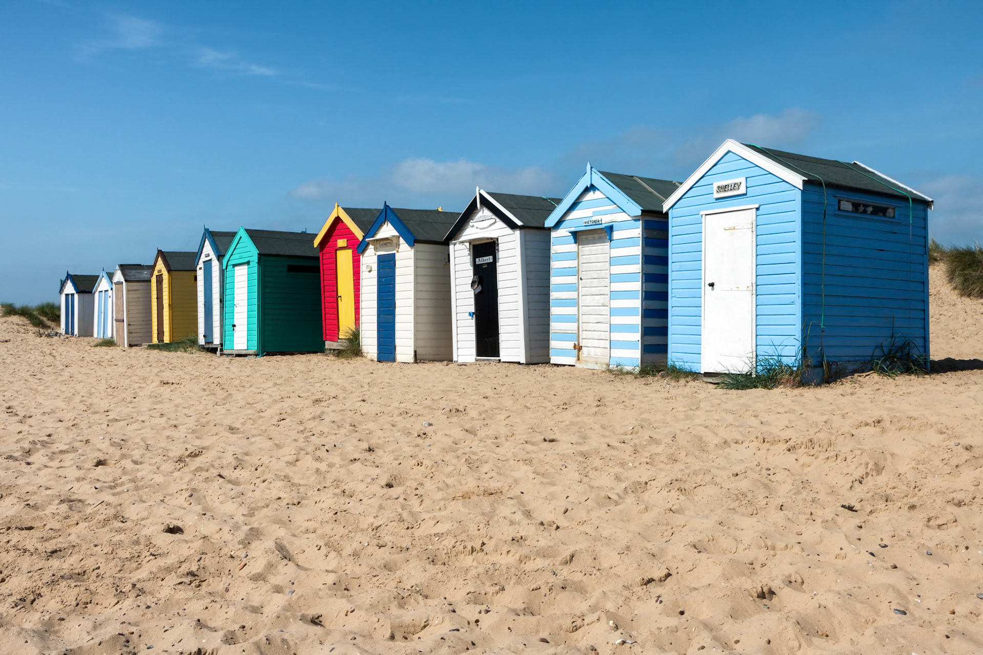 Colourful Beach Huts on Southwold Beach Suffolk