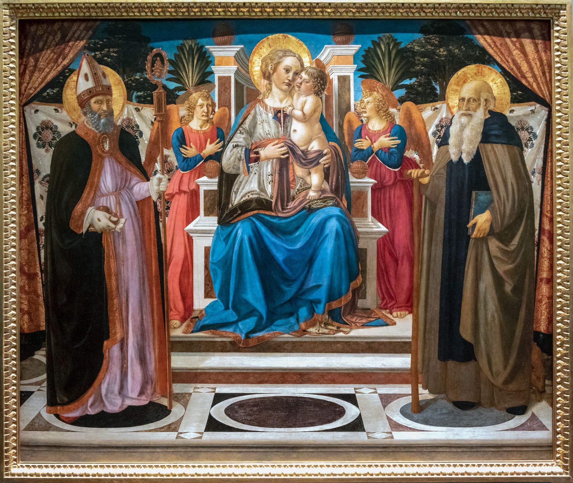 FLORENCE, TUSCANY/ITALY - OCTOBER 19 : Madonna and child enthroned with angels St Nicholas and St Anthony the Abbot painting in the Uffizi gallery in Florence on October 19, 2019
