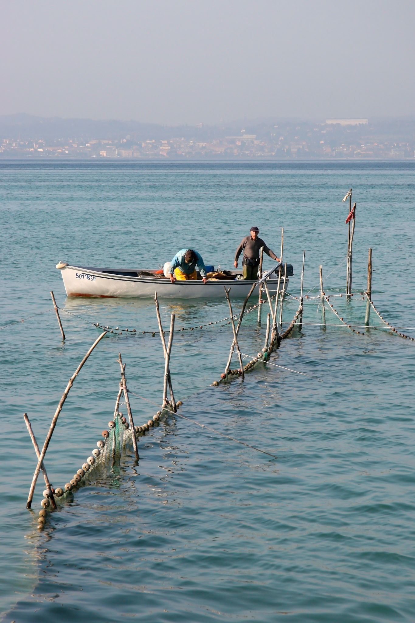 Fishermen Checking their Nets at Lake Garda