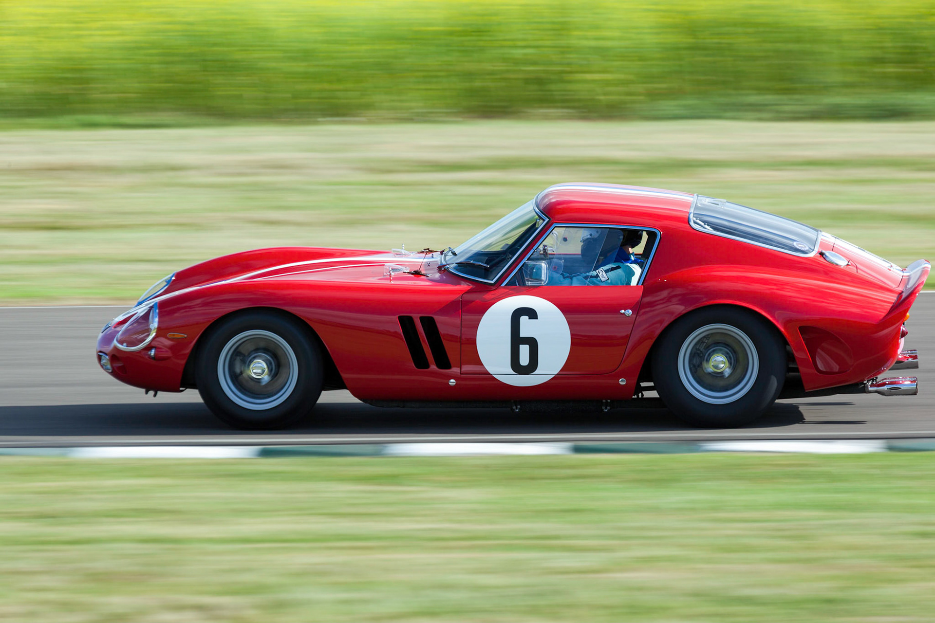 GOODWOOD, WEST SUSSEX/UK - SEPTEMBER 14 : Vintage Racing at Goodwood on September 14, 2012. One unidentified person