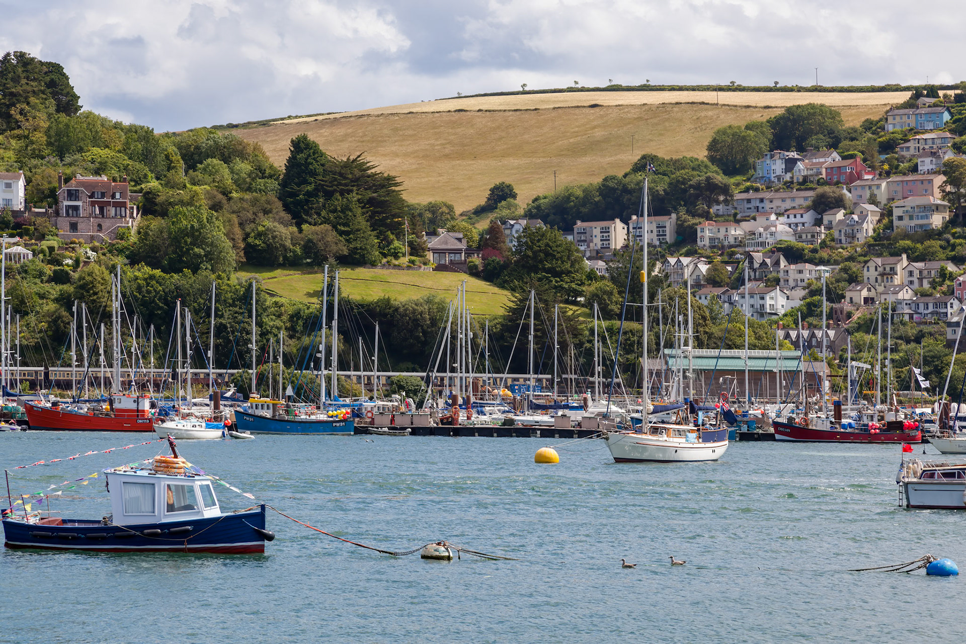 DARTMOUTH, DEVON, UK - JULY 29 : View of various boats moored on the River Dart in Dartmouth, Devon on July 29, 2012
