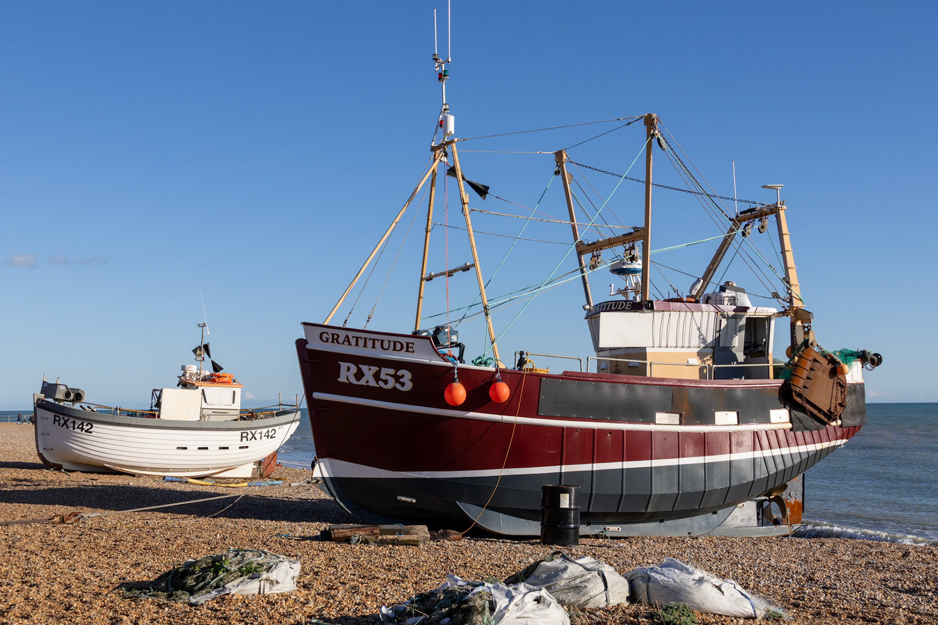 Hastings, East Sussex, UK - February 12. View of a fishing boat on the beach at Hastings, East Sussex on February 12, 2024