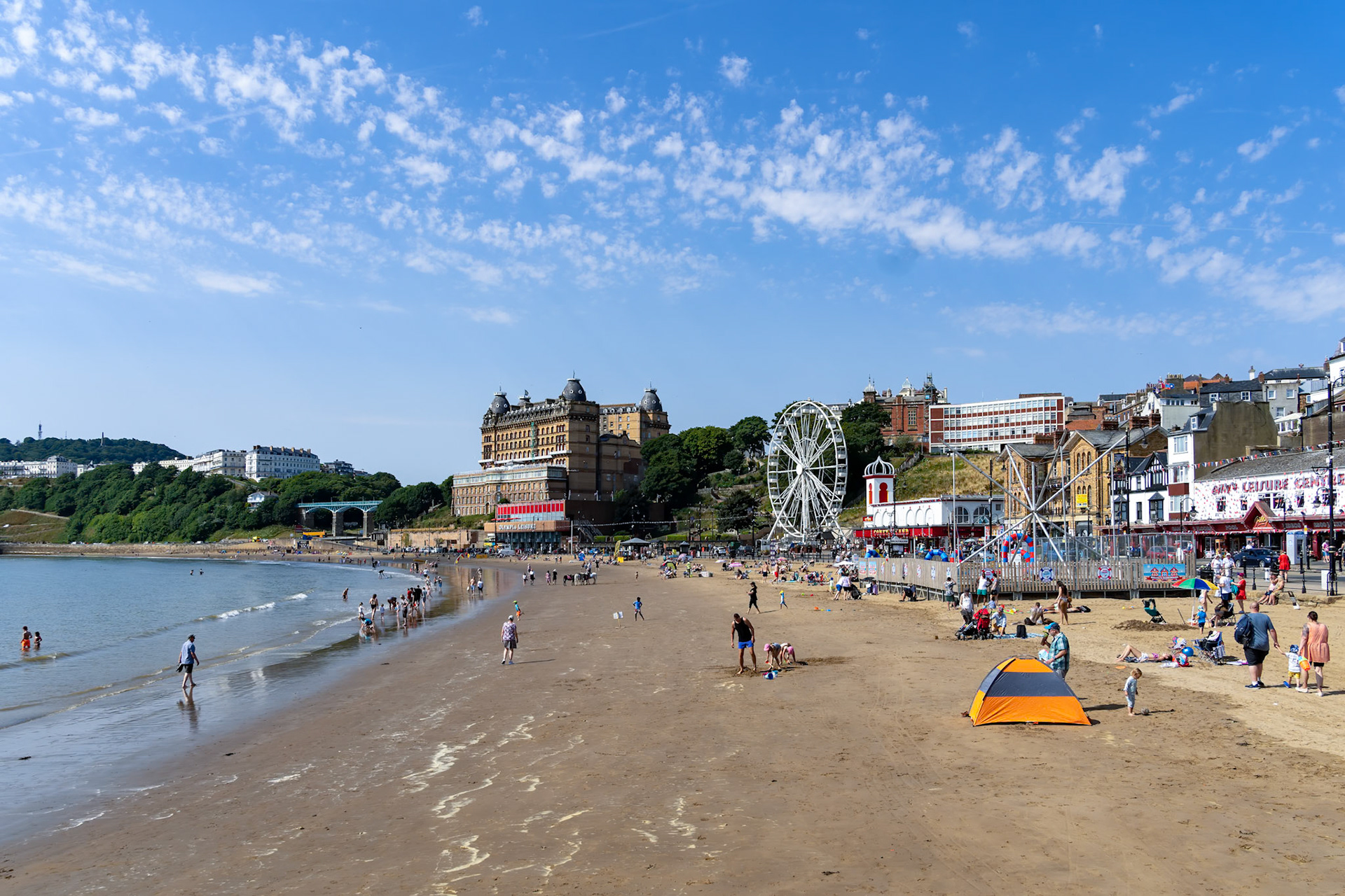 SCARBOROUGH,  NORTH YORKSHIRE, UK - JULY 18: View of the sea front in Scarborough, North Yorkshire on July 18, 2022. Unidentified people