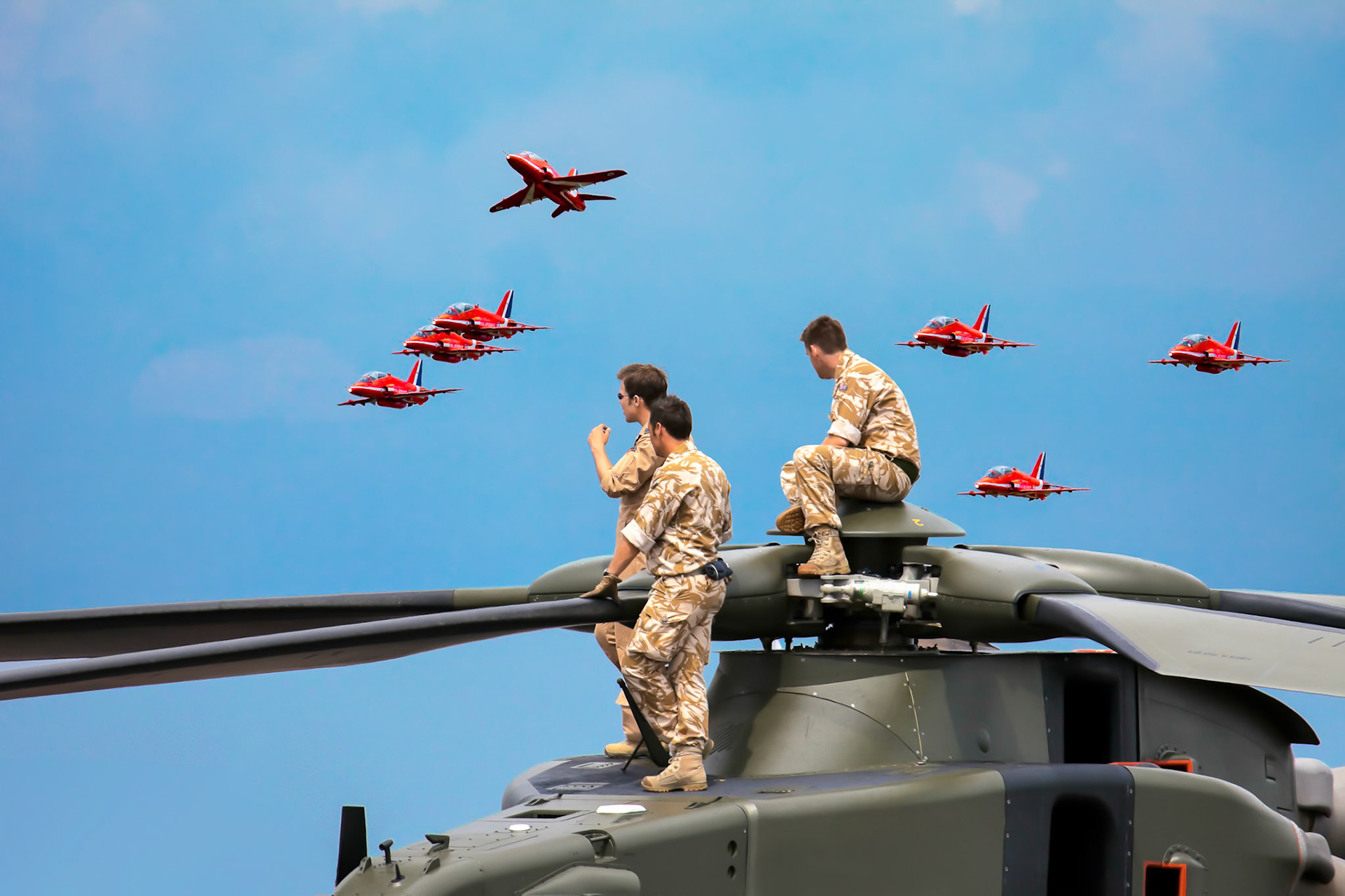 Helicopter Crew Watching the Red Arrows Display