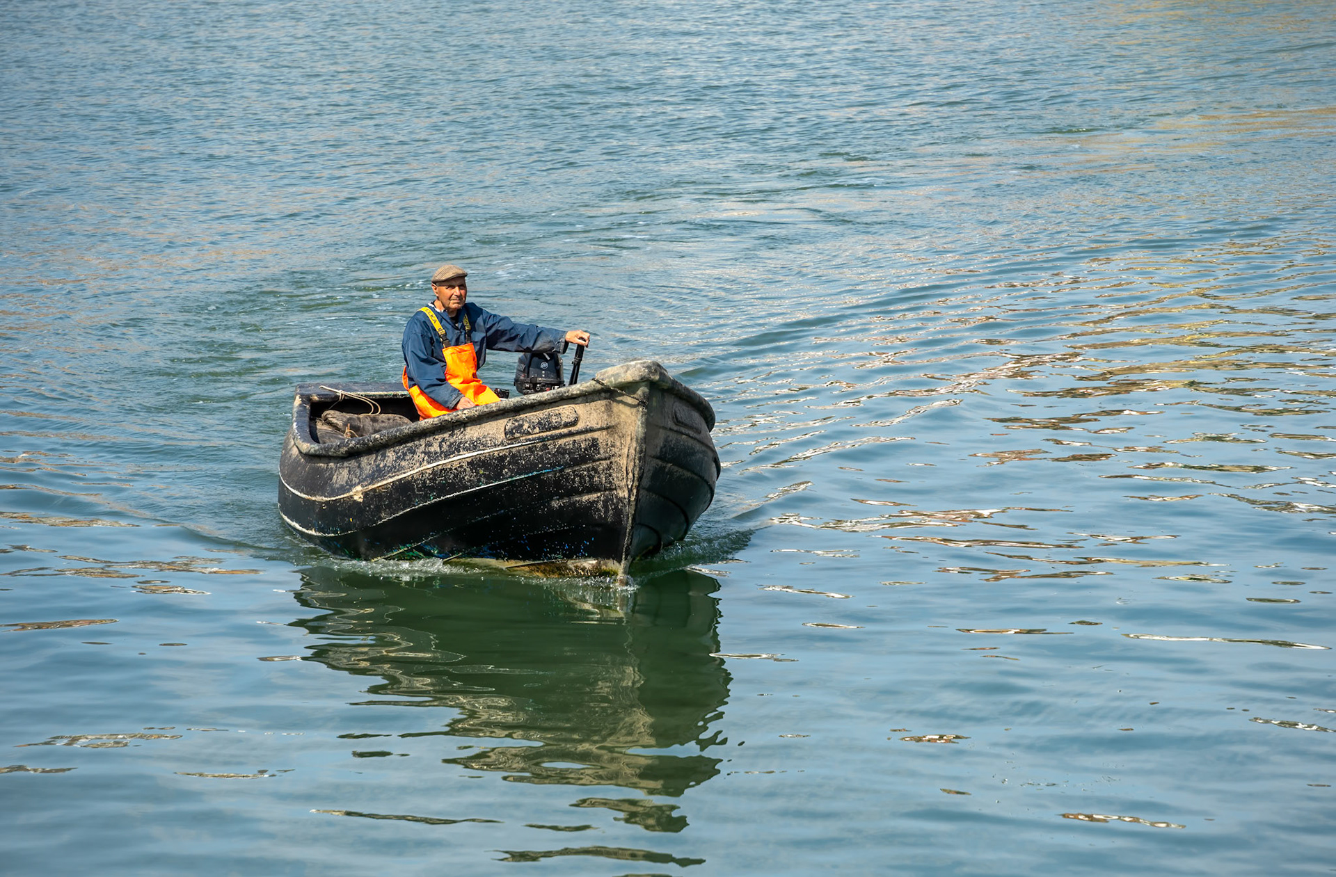 SCARBOROUGH,  NORTH YORKSHIRE, UK - JULY 18: Man in small fishing boat in Scarborough, North Yorkshire on July 18, 2022. Unidentified man