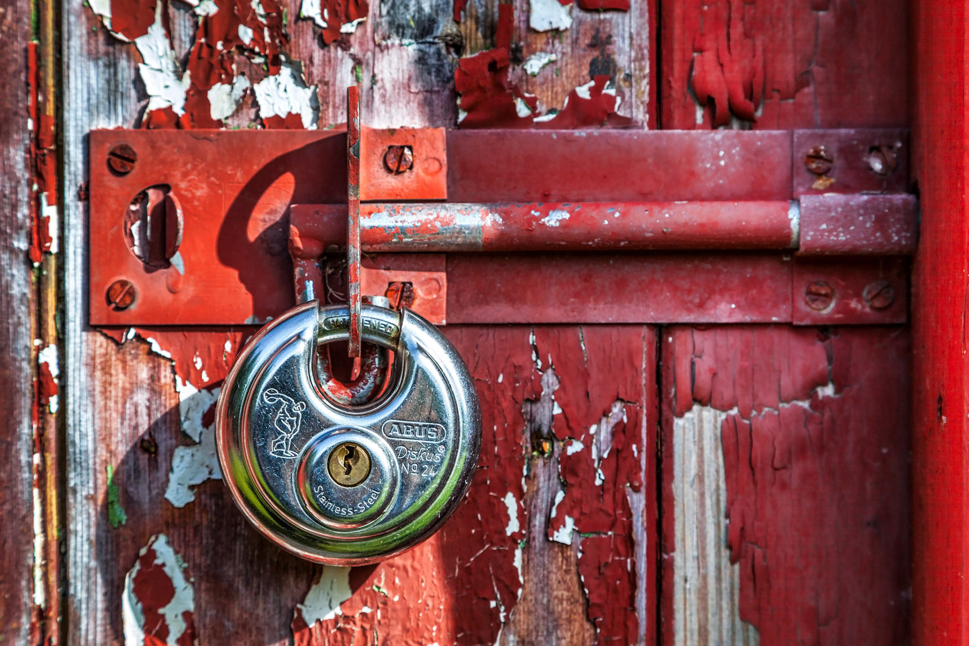 Shiny New Padlock on an Old Door