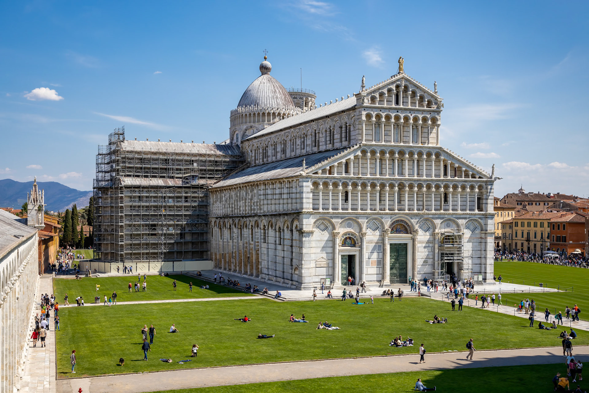 PISA, TUSCANY, ITALY  - APRIL 18 : Exterior view of the Cathedral in Pisa Tuscany Italy on April 18, 2019. Unidentified people