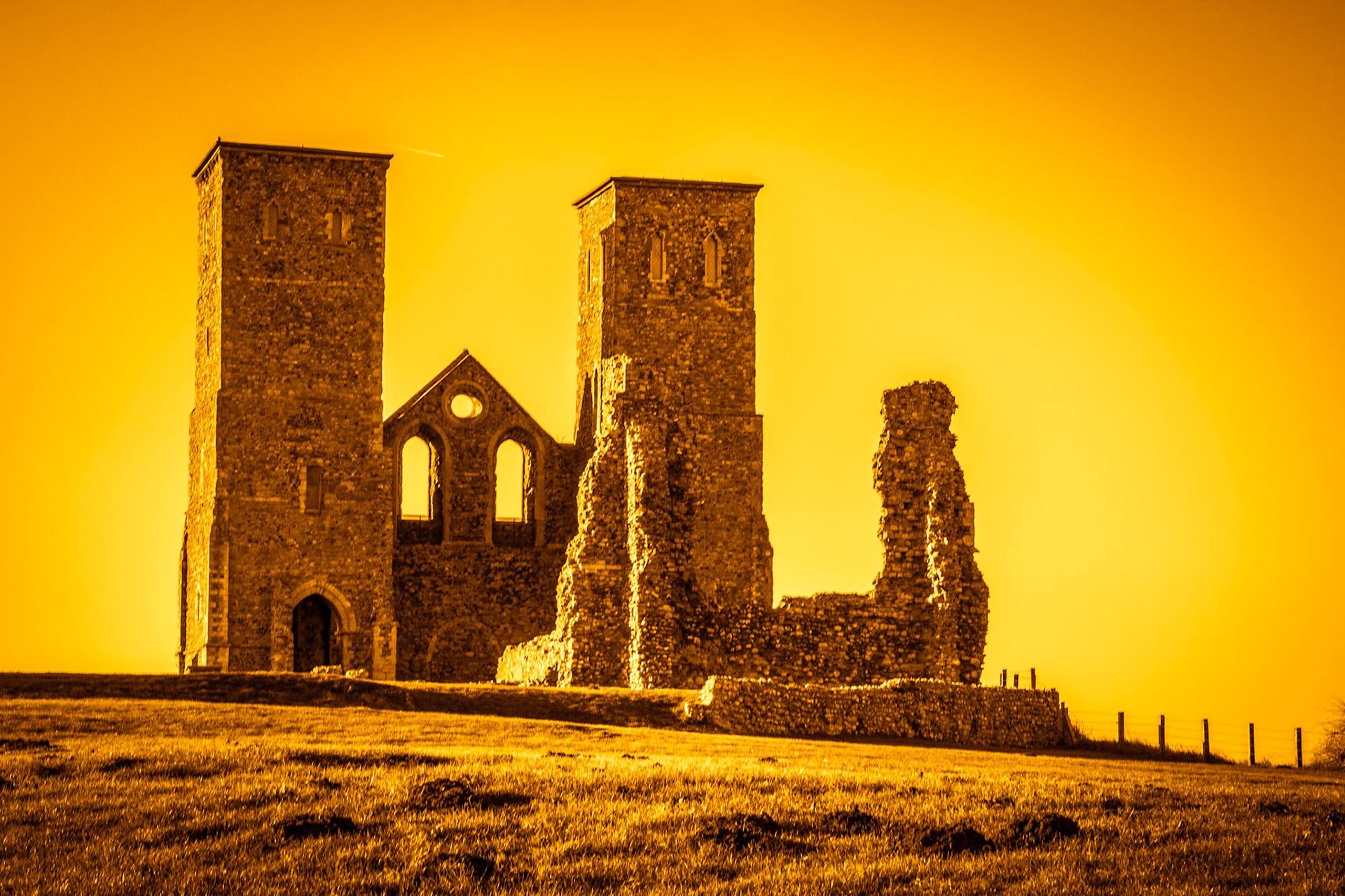Remains of Reculver Church Towers Bathed in Late Afternoon Sun in Winter