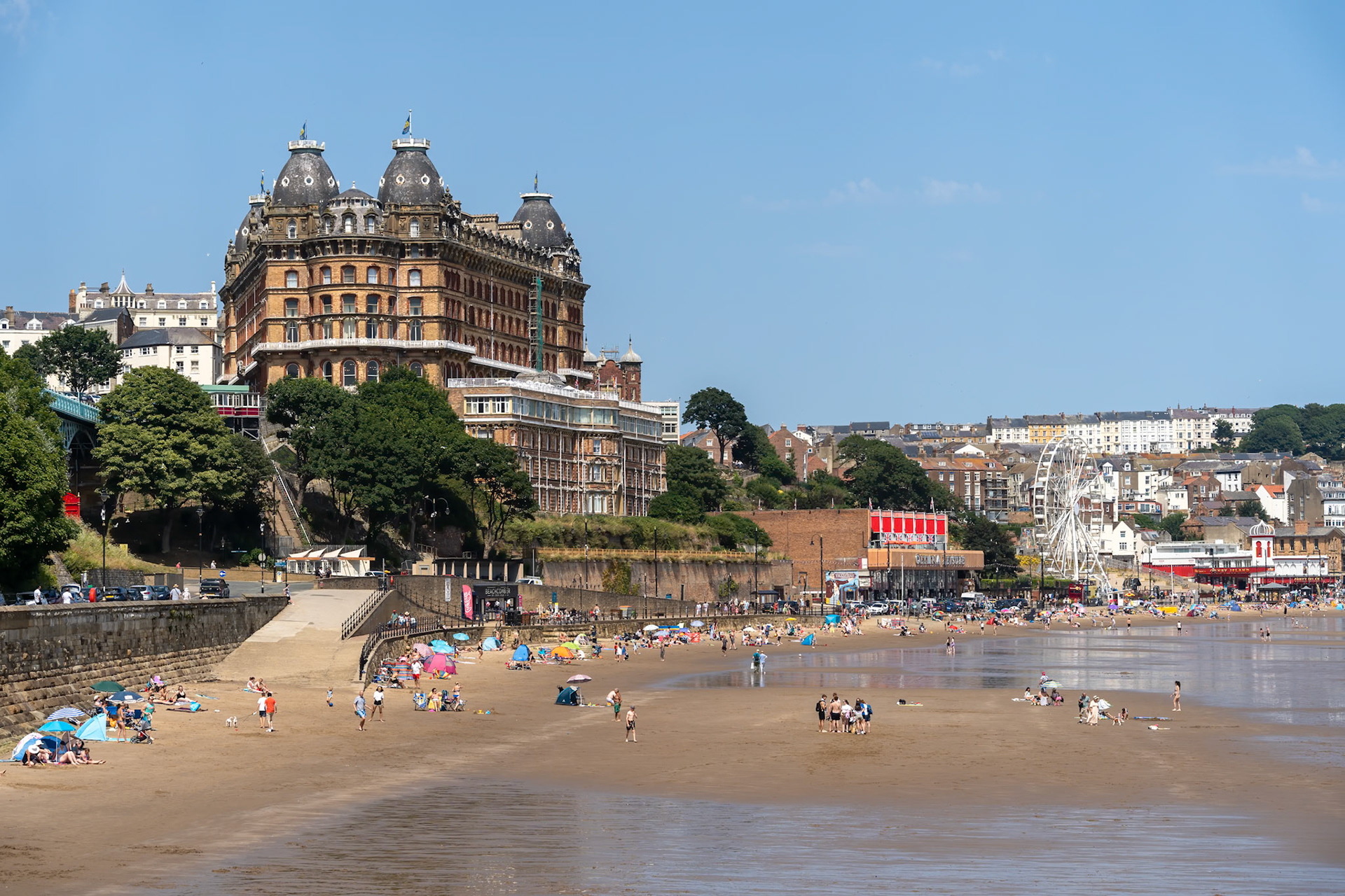 SCARBOROUGH,  NORTH YORKSHIRE, UK - JULY 18: View of the sea front in Scarborough, North Yorkshire on July 18, 2022. Unidentified people