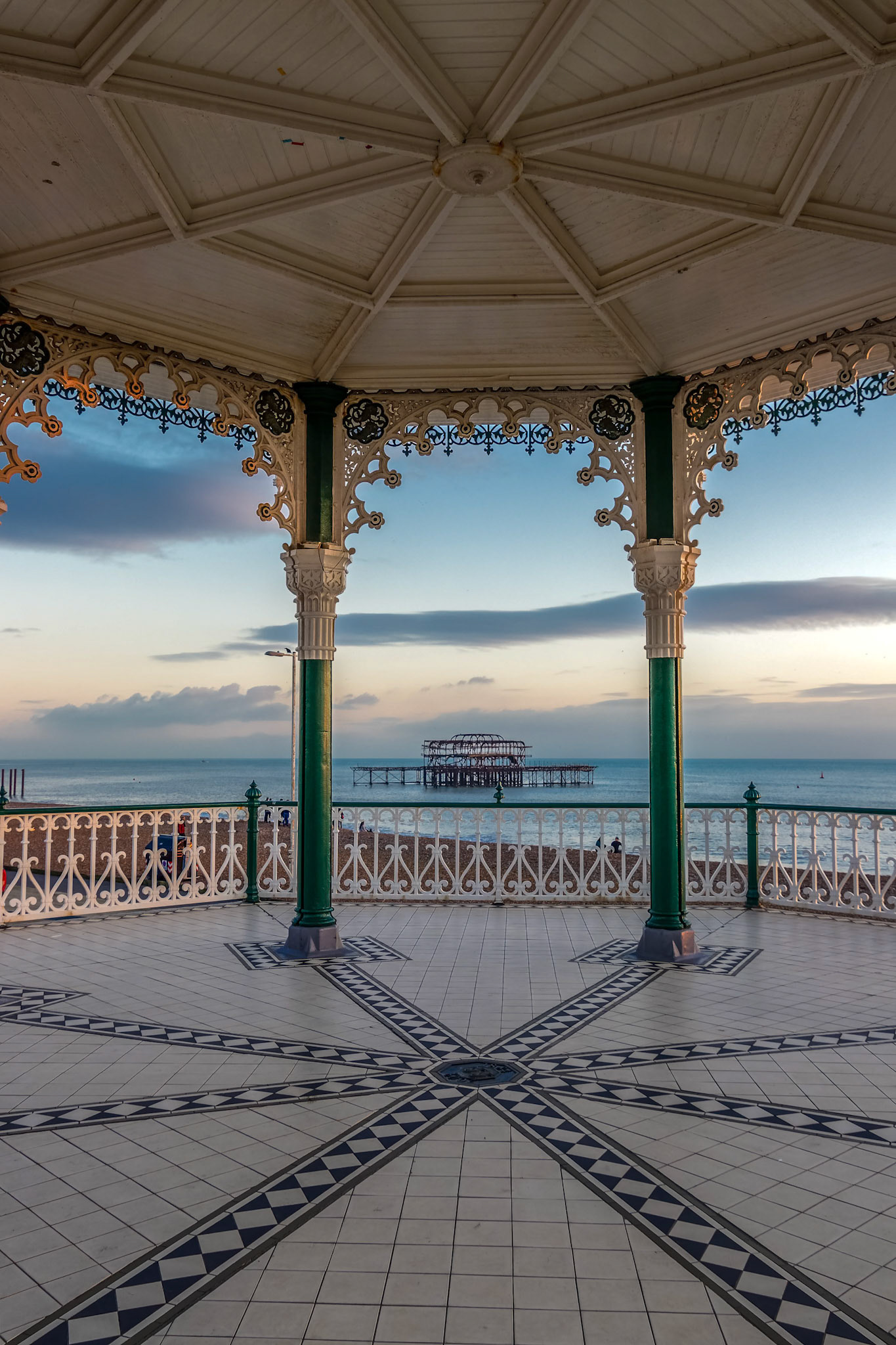 BRIGHTON, EAST SUSSEX/UK - JANUARY 26 : View of the derelict West Pier from a Bandstand in Brighton East Sussex on January 26, 2018. Unidentified people