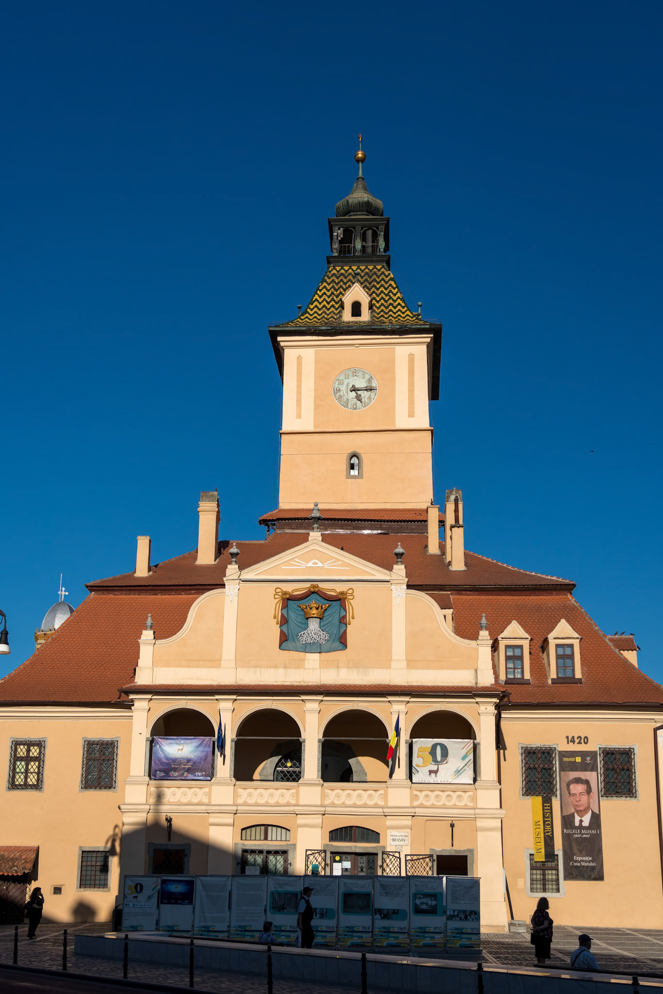 BRASOV, TRANSYLVANIA/ROMANIA - SEPTEMBER 20 : View of the old town hall in Brasov Transylvania Romania on September 20, 2018. Four unidentified people