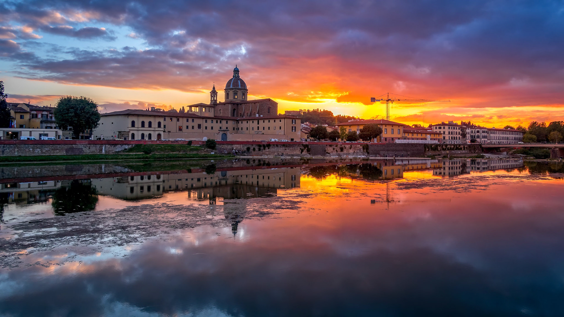 FLORENCE, TUSCANY/ITALY - OCTOBER 19 : View of buildings along the River Arno at dusk  in Florence  on October 19, 2019
