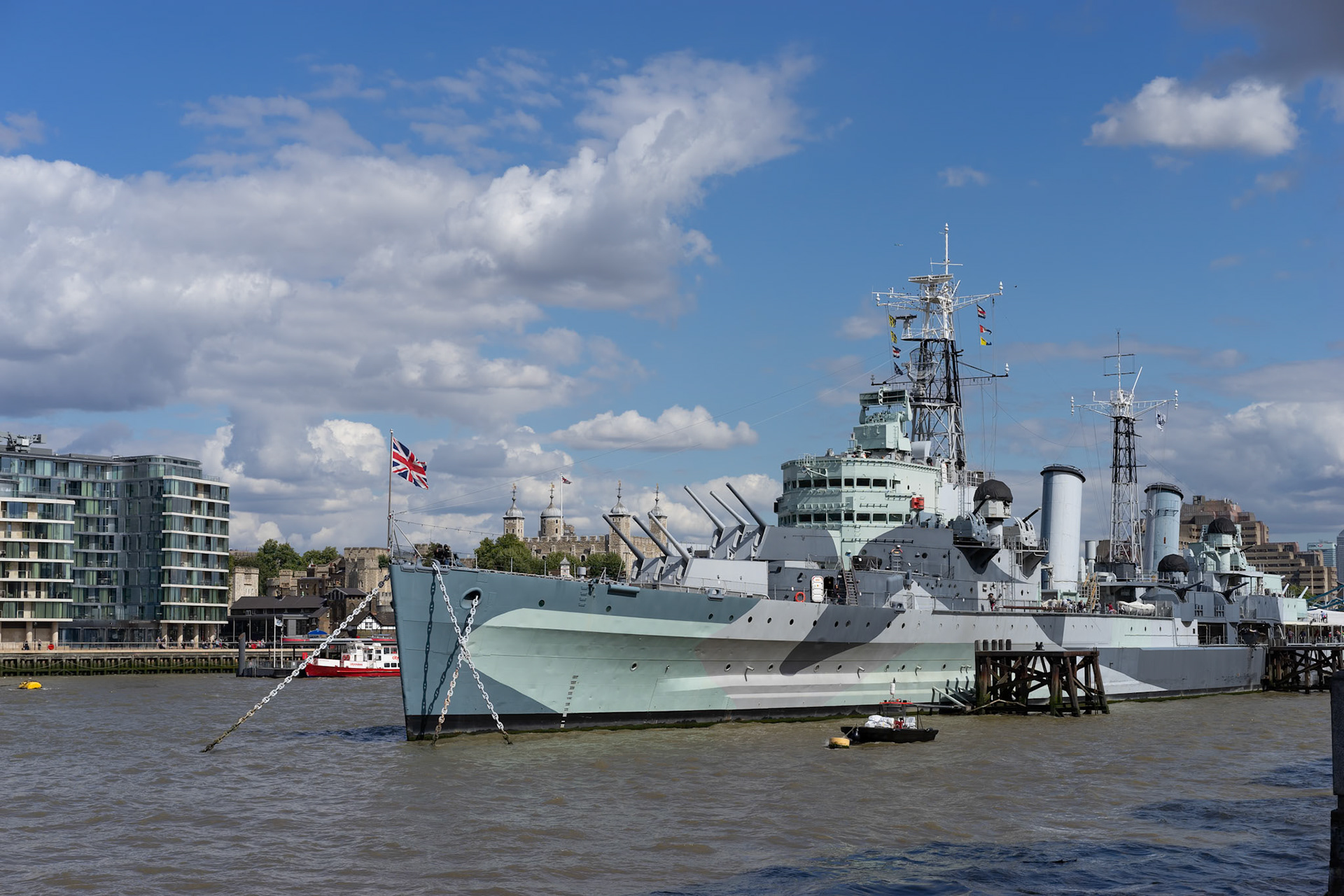 LONDON, UK - AUGUST 22 : HMS Belfast anchored near Tower Bridge in London on August 22, 2014. Unidentified people.