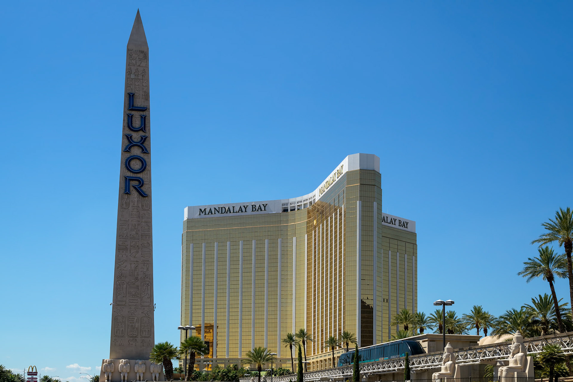 LAS VEGAS, NEVADA, USA - AUGUST 1 : Replica Cleopatra's Needle at the Luxor Hotel with the Mandalay Bay Hotel in Las Vegas on August 1, 2011