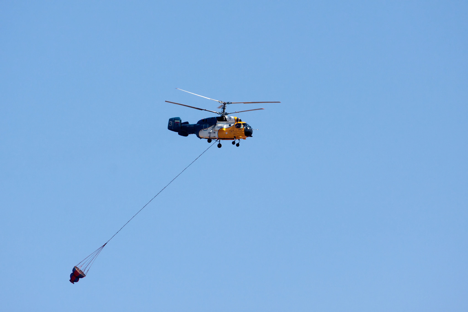 Helicopter Flying over a Dam in Cyprus to Collect Water