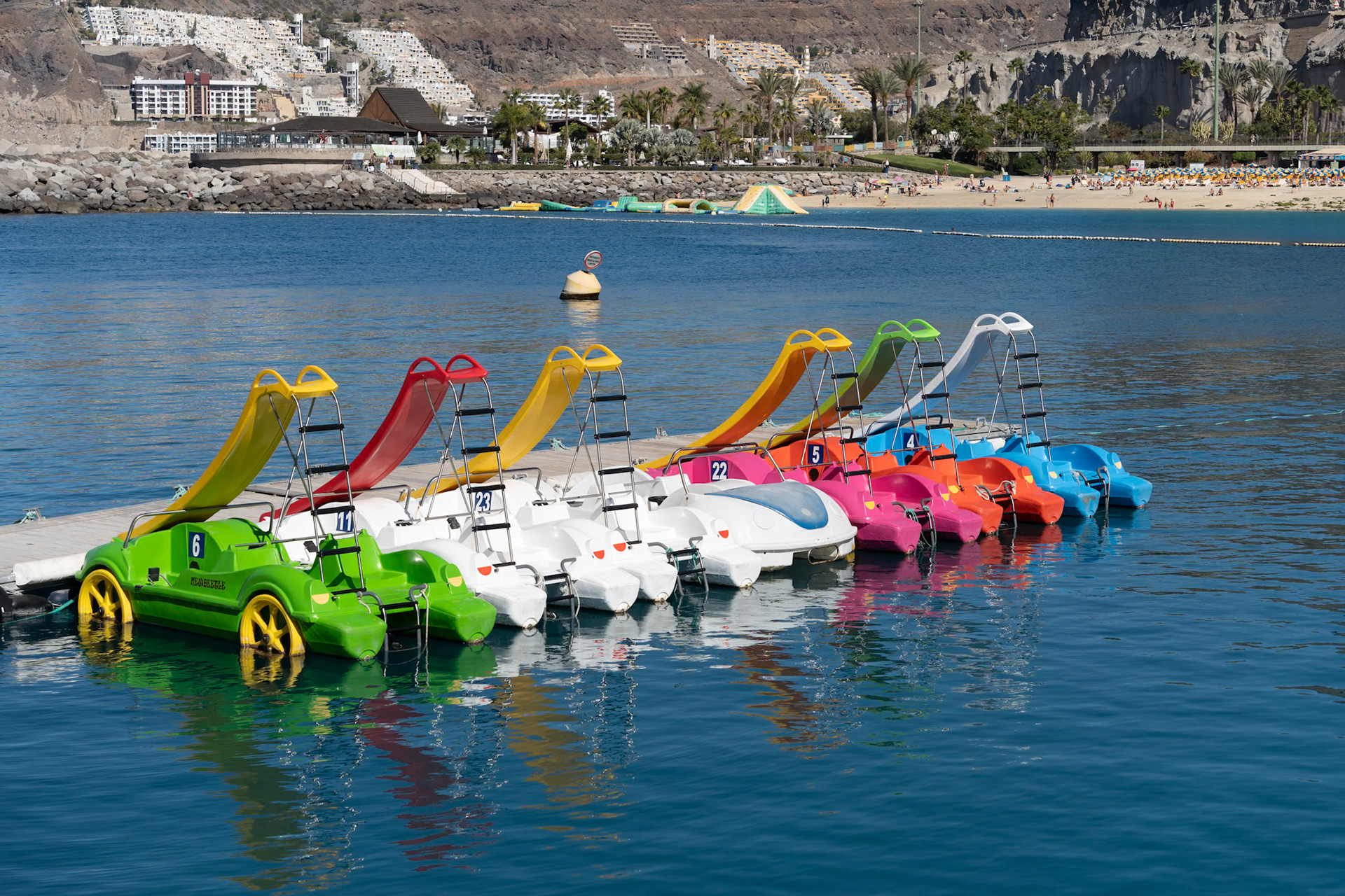AMADORES, GRAN CANARIA, CANARY ISLANDS, SPAIN - MARCH 6 : Pedalos at Amadores, Gran Canaria on March 6, 2022
