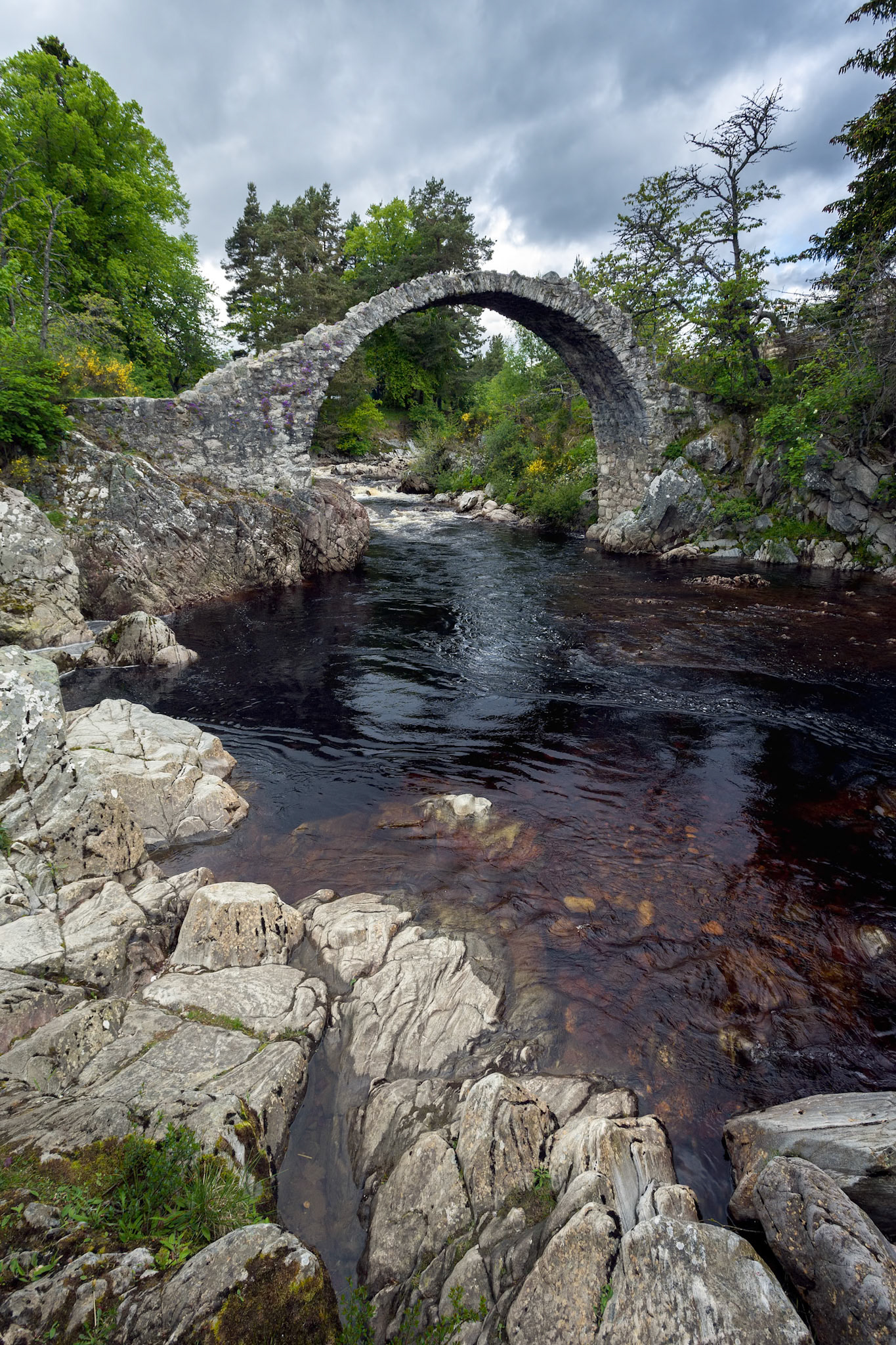 CARRBRIDGE, BADENOCH and STRATHSPEY/SCOTLAND - MAY 21 : Packhorse bridge at Carrbridge Scotland on May 21, 2011