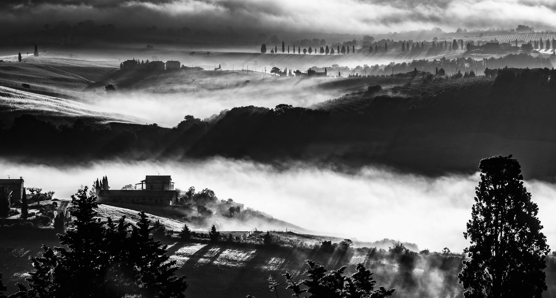 Mist rolling through Val d' Orcia