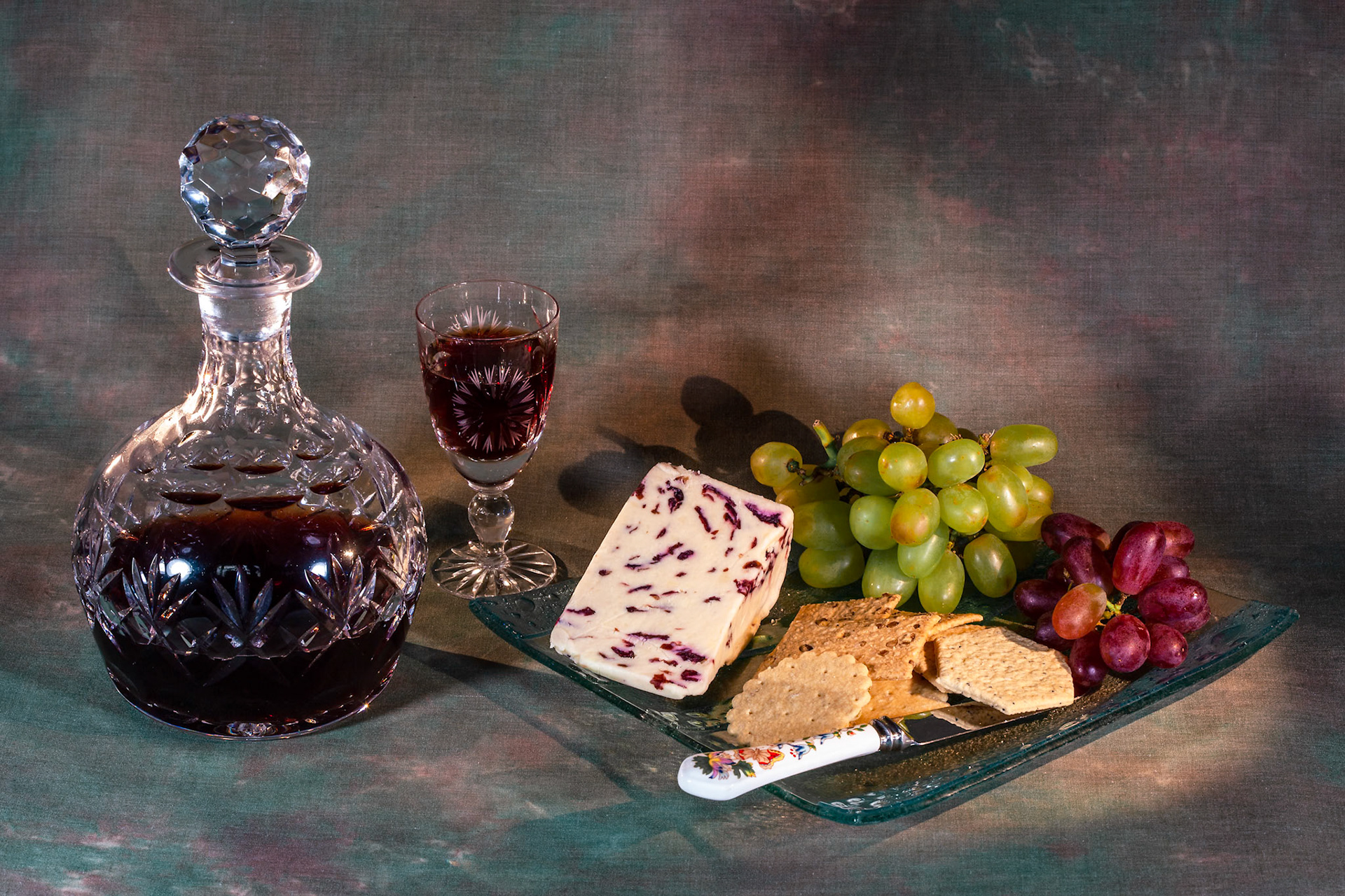 A glass of port, some cheese and biscuits