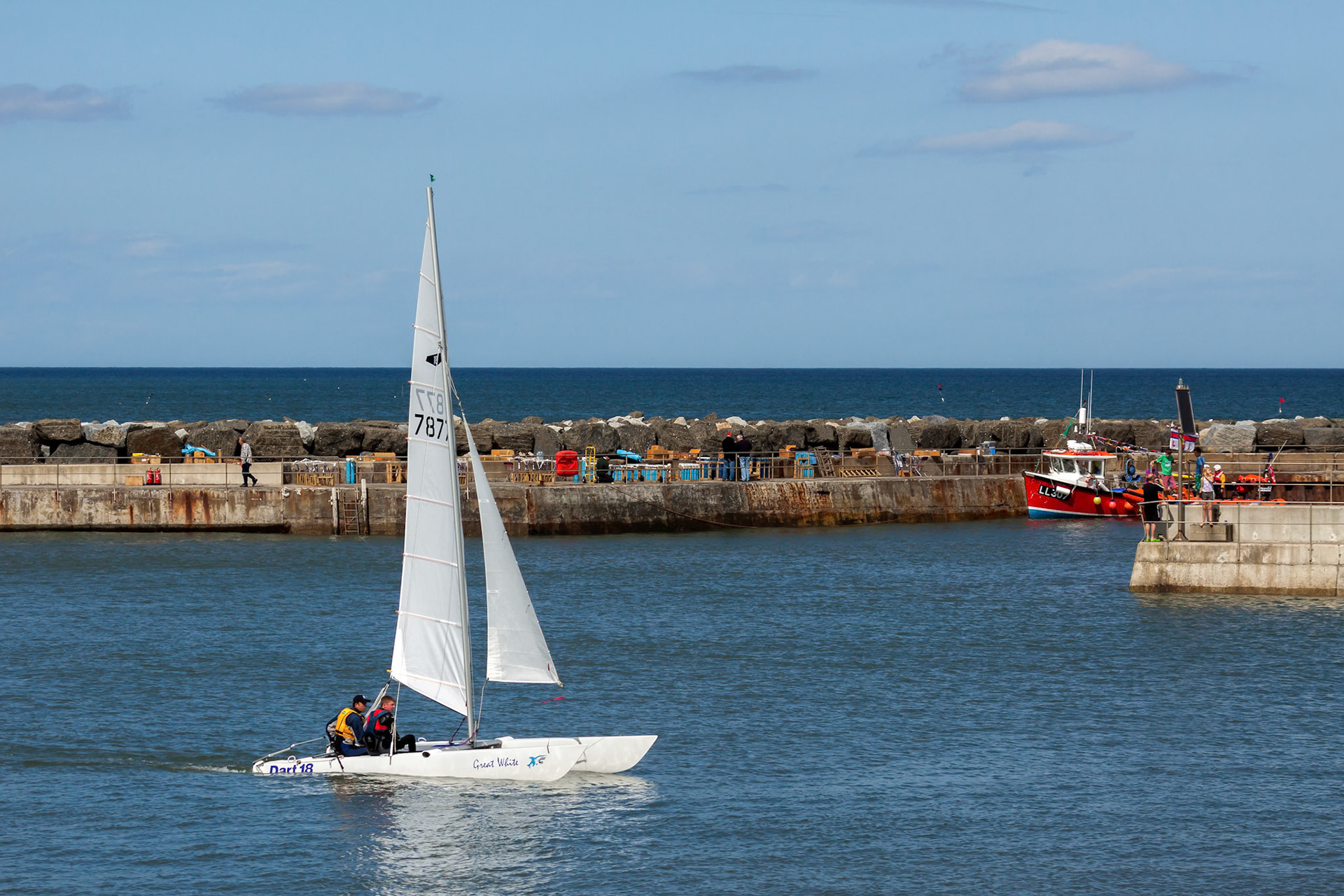 Great White Catamaran Sailing in Staithes Harbour