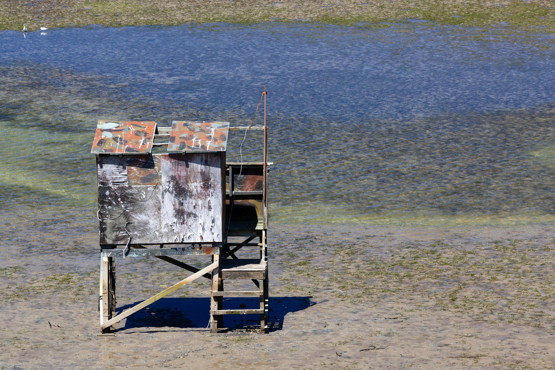 Wooden fishing hut on stilts at Kairua inlet