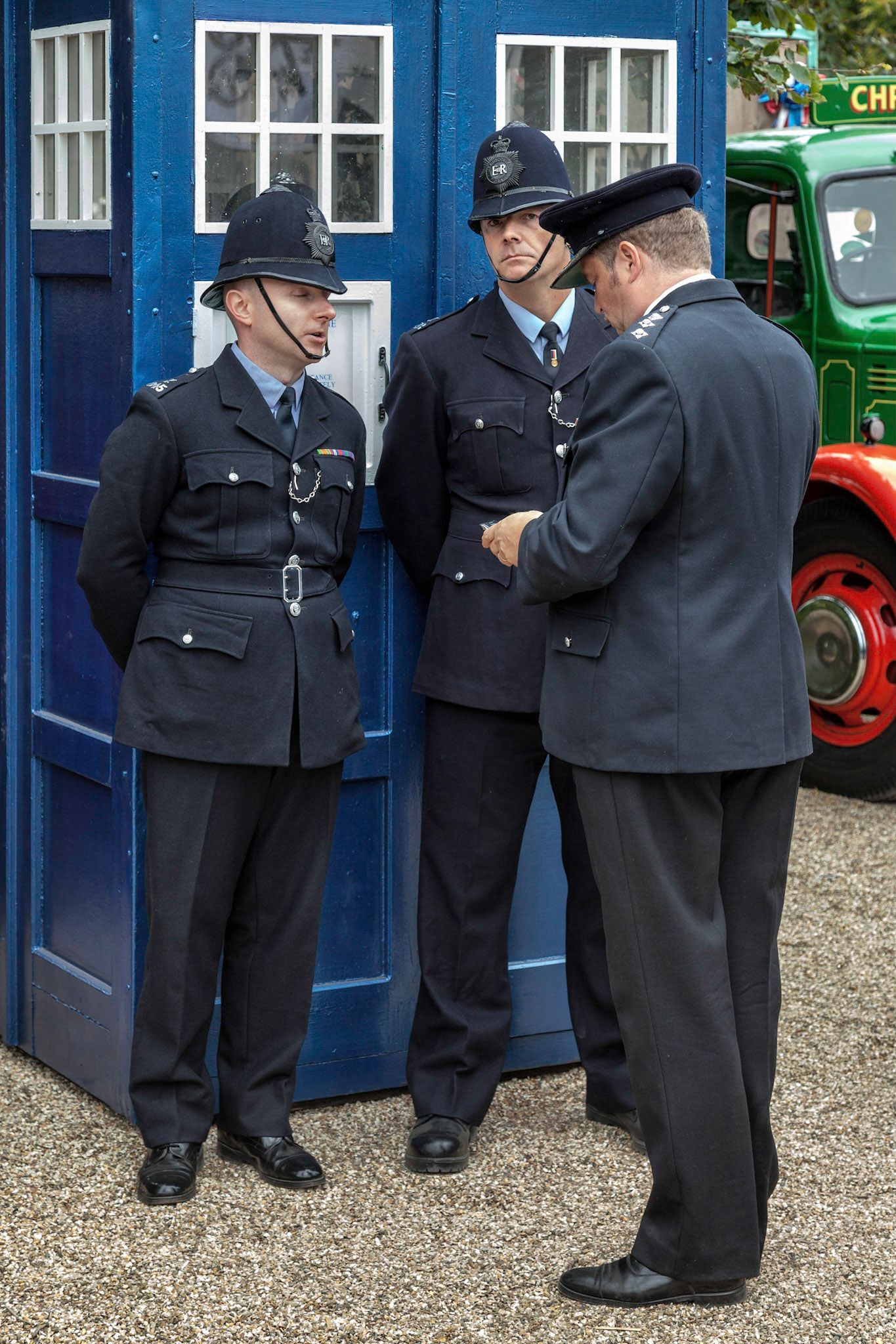 Policemen outside an Old Fashioned English Blue Police Box